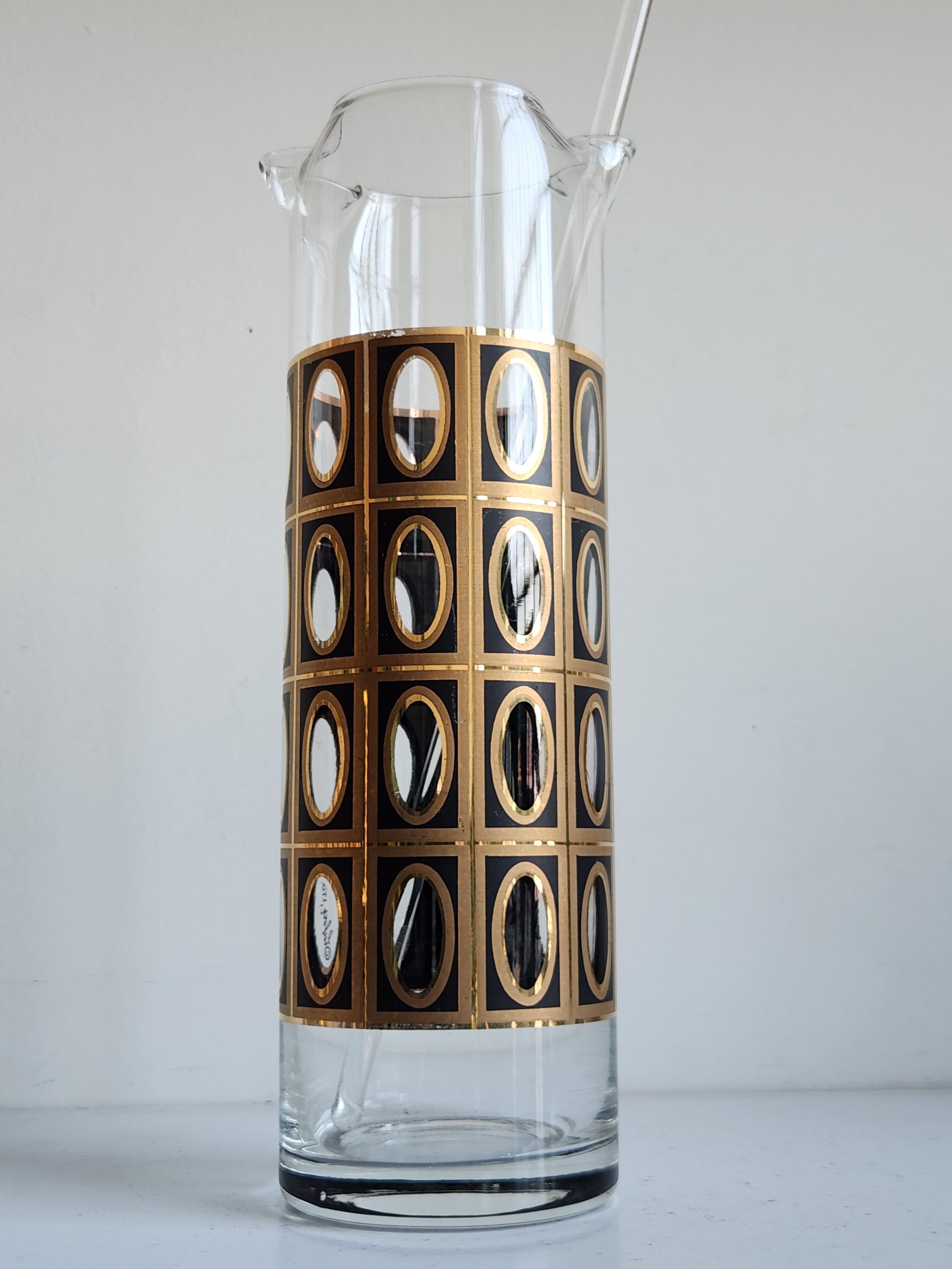 A very rare Black and gold martini pitcher by Culver Glass Company. This design, known as Morocco, features four rows of gold ovals in a grid pattern over a black background. Culver was famous for using 22kt gold in their paint applications, adding