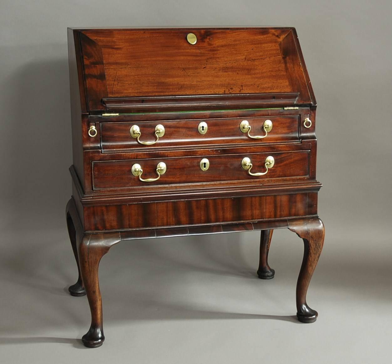 A rare mid-18th century mahogany bureau on Stand of elegant design and of small proportions.

This bureau consists of a solid mahogany top leading down to the solid mahogany fall, the timber choice on this piece is of excellent quality.

The