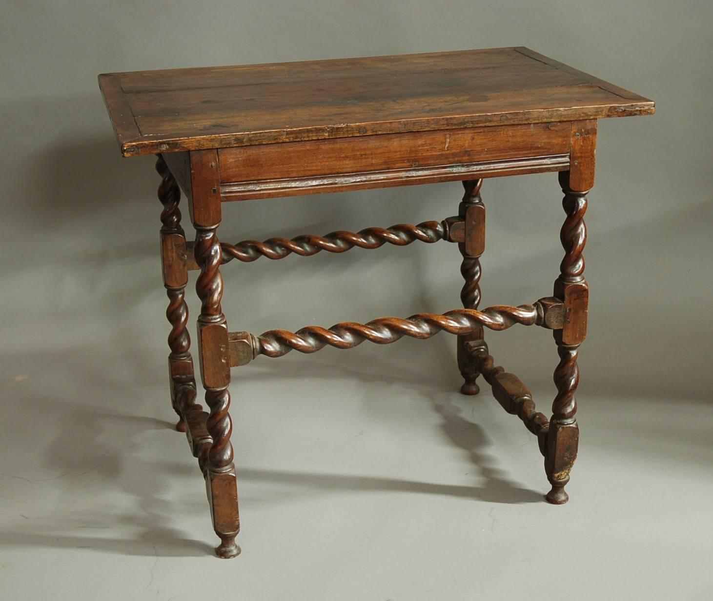 A late 17th century walnut table of good quality and good patina.

The table consists of a three plank walnut top with a mitered walnut edge.
 
This leads down to moulded rails, one of these has been replaced over the years with an oak