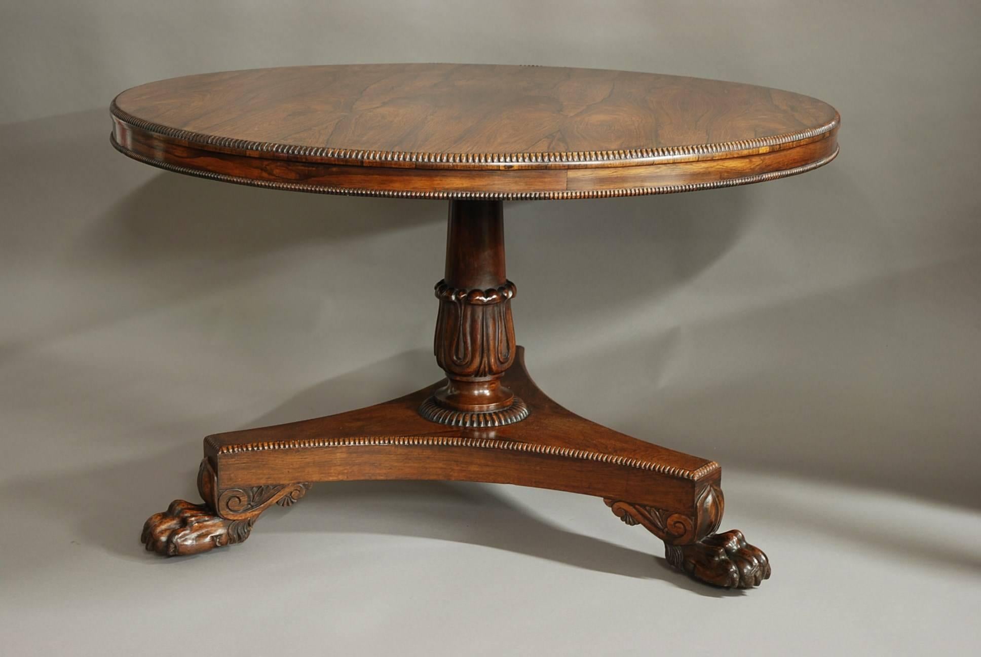 A good quality William IV superbly figured rosewood breakfast table. 

The top is mirror veneered with superbly figured rosewood with a turned moulding, leading down to a veneered frieze and further turned moulding.

The central column is