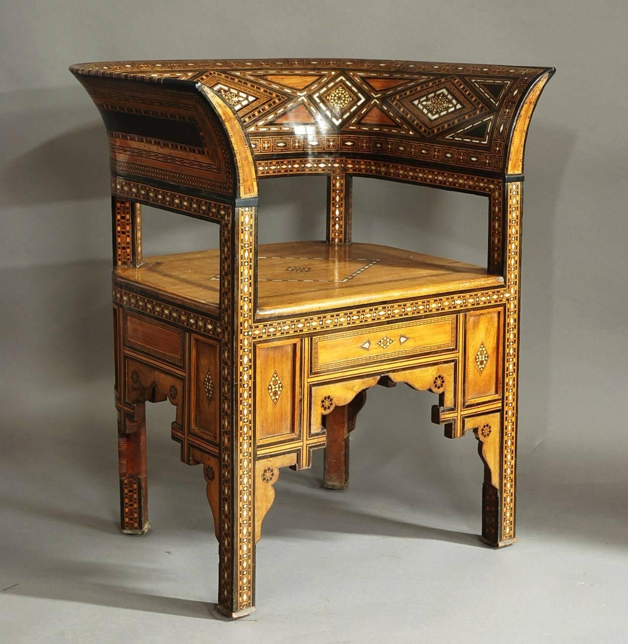 A highly decorative late 19th-early 20th century Middle Eastern Damascus inlaid armchair of superb patina.

This chair consists of a rounded back profusely inlaid with decorative mosaic geometric designs in excellent condition. 

These designs,