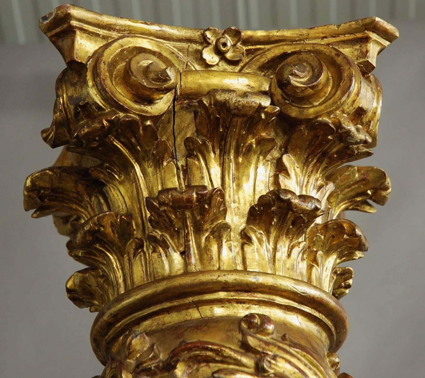 A highly decorative large pair of late 18th century Baroque style Solomonic carved gilt wood columns, possibly Spanish or Italian with original gilding.

This stunning pair of columns consist of Corinthian capitals to the top carved with scrolling