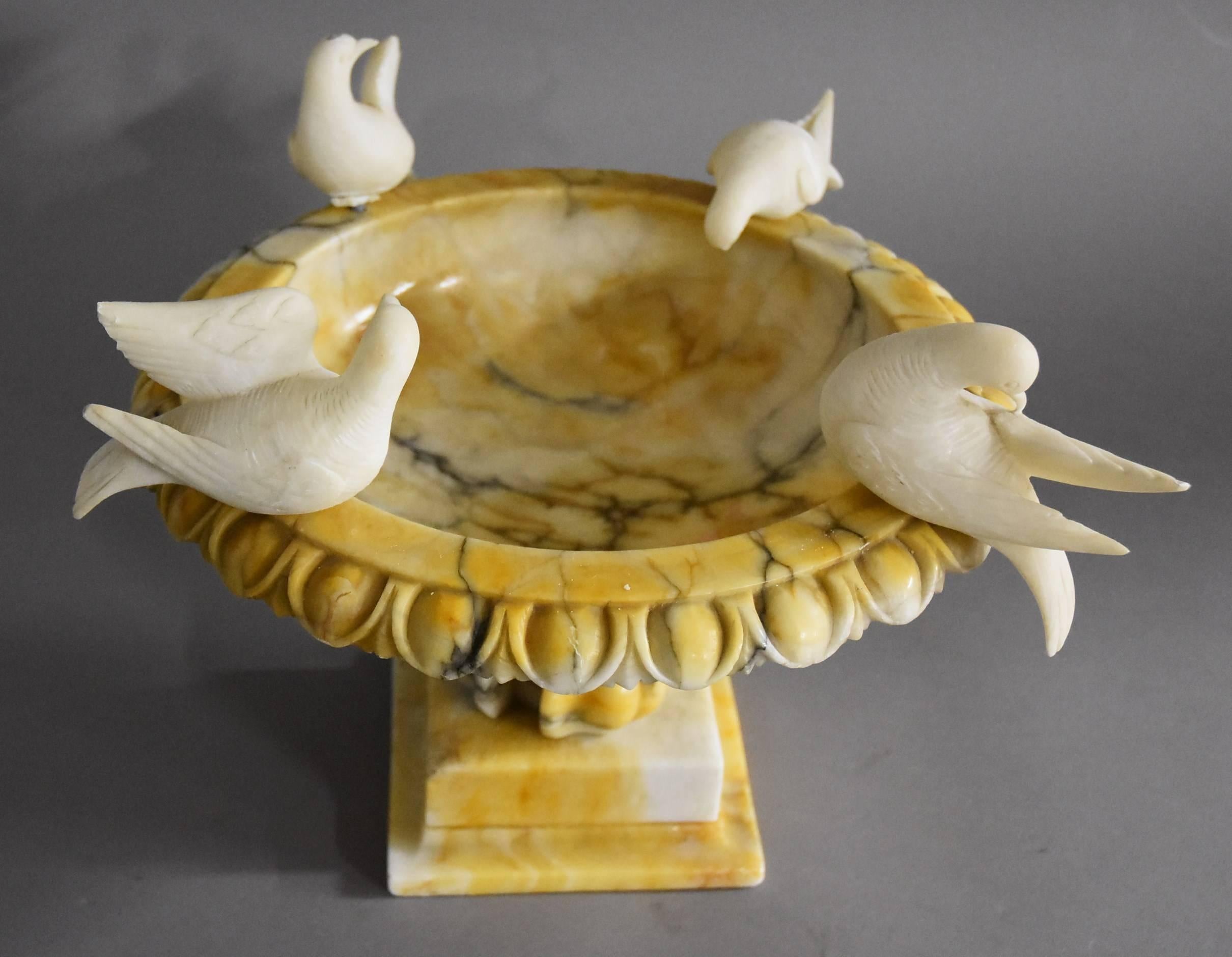 alabaster bird bath with doves