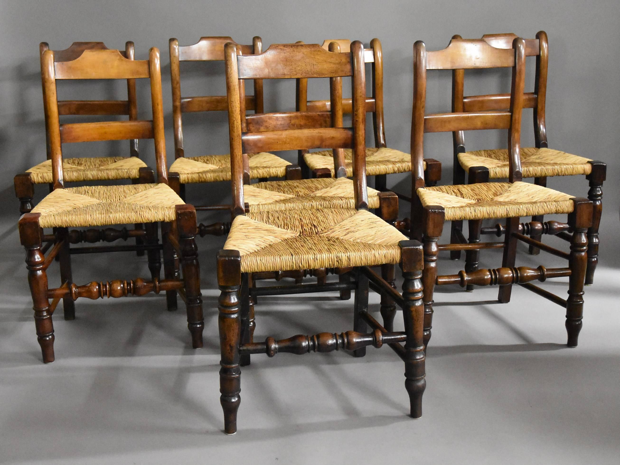 A mid-late 19th century set of eight alder dining chairs (or kitchen chairs) of good patina (colour) from the Lancashire area.

Each of the chairs consist of a shaped top rail with a straight back splat and shaped uprights to each side leading