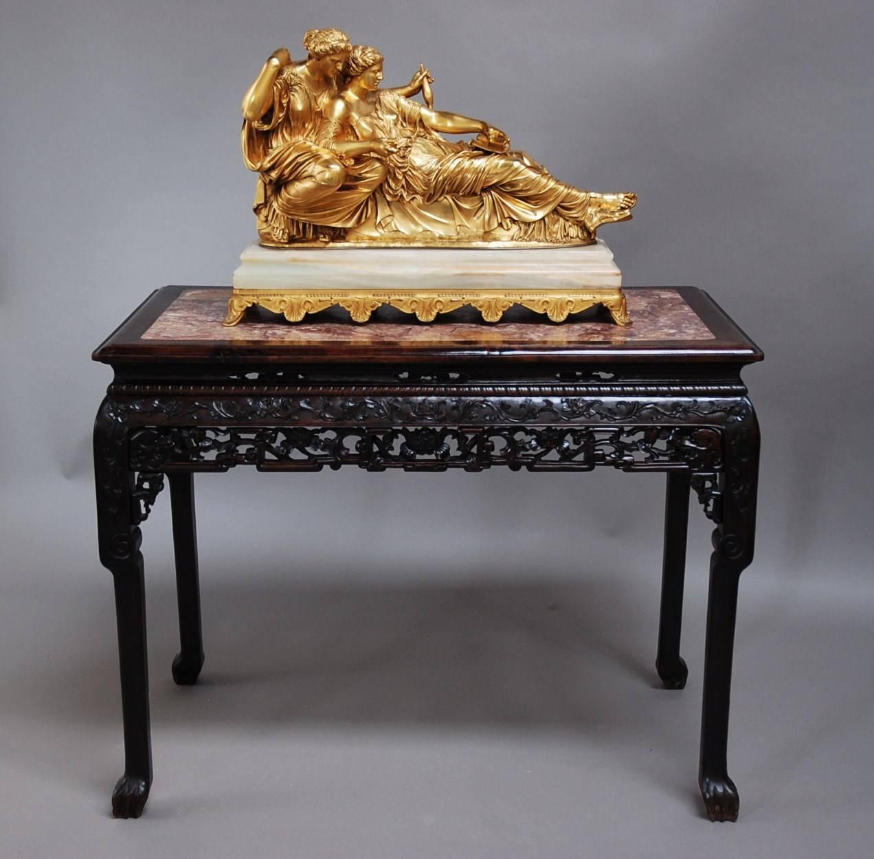 A superb quality late 19th century Qing Dynasty Chinese hardwood centre table with marble top.

The top consists of a rectangular rouge marble top surrounded by a moulded edge.

This leads down to a superb quality pierced and carved frieze, this