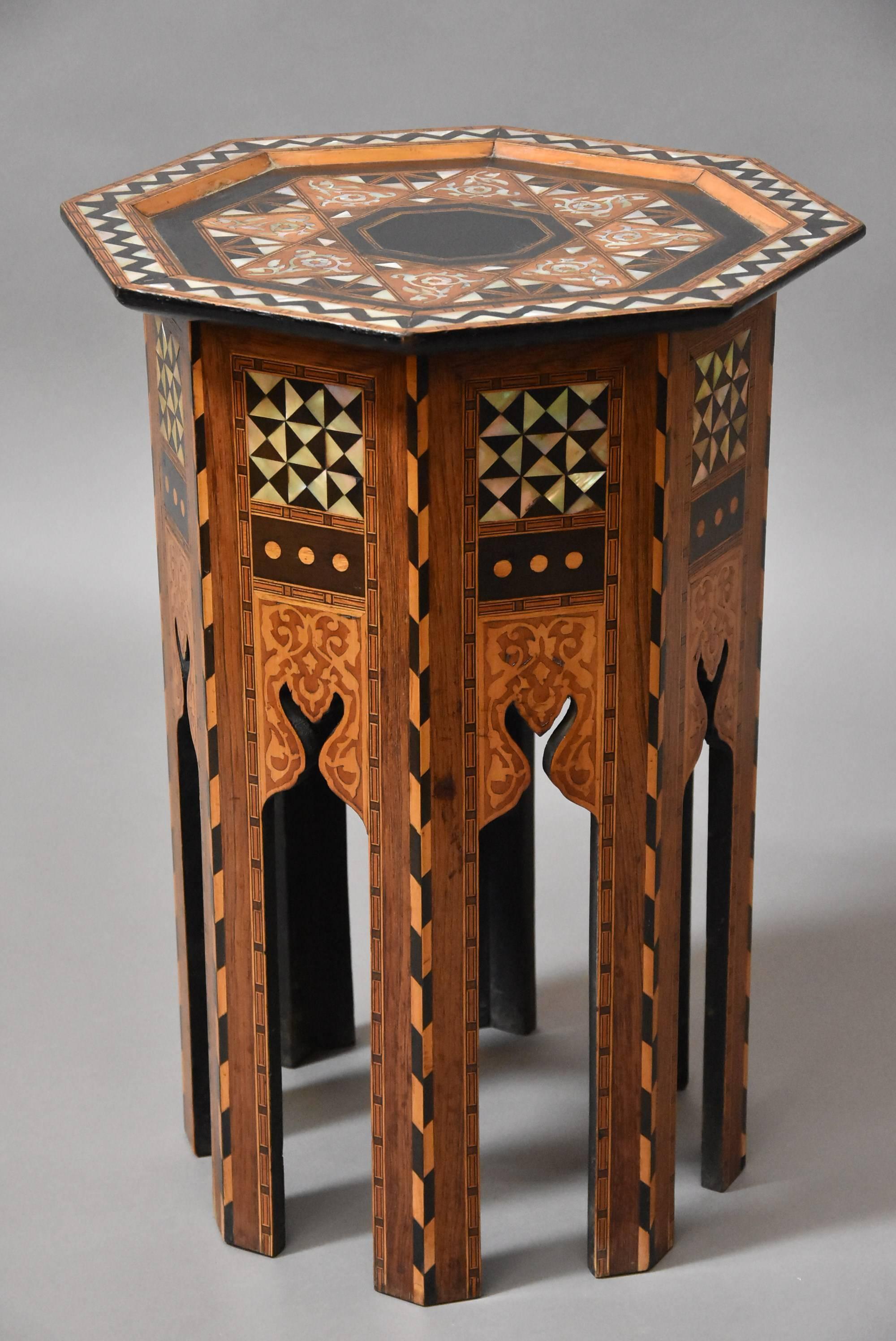 A late 19th century Liberty & Co. inlaid table or coffee stool of octagonal shape in excellent original condition. 

The top consists of inlaid decoration of mother of pearl and various exotic woods to create a decorative geometric design.