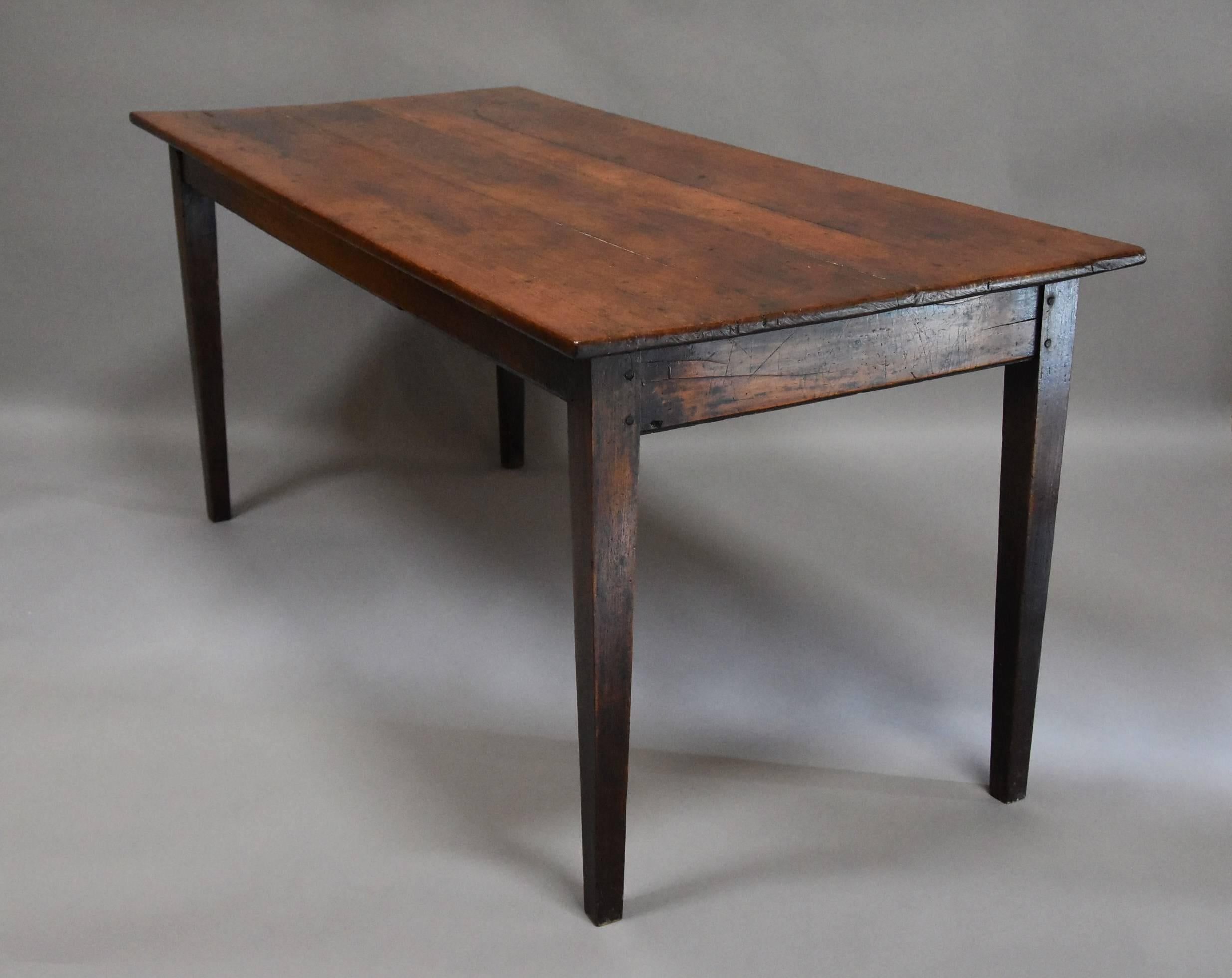 A French 19th century fruitwood ‘cherry’ and elm farmhouse table.

This table consists of a four plank cherry top of fine patina with a single drawer to the front with poplar linings leading down to four elm legs of tapered form.

This table is