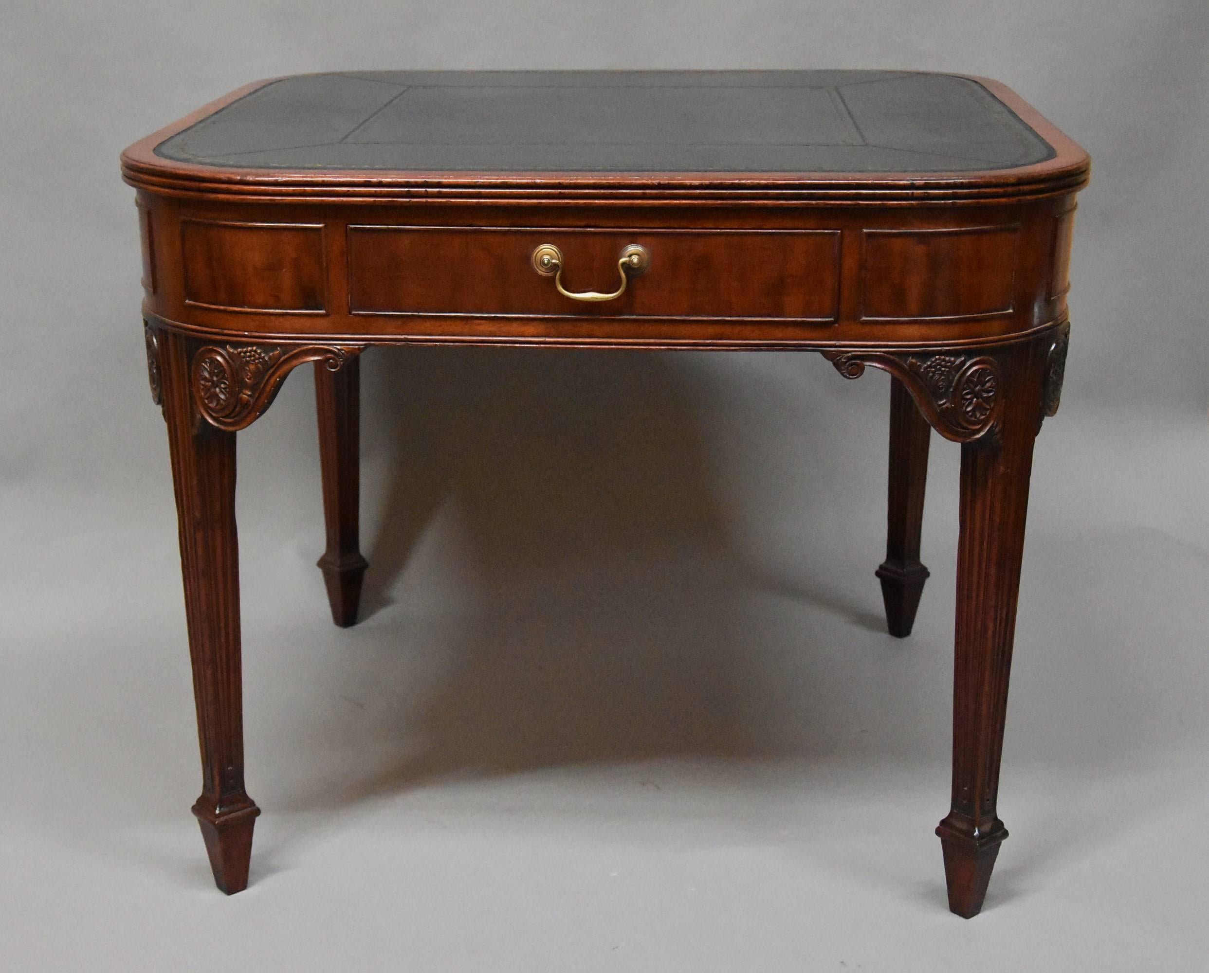 An English mid-late 19th century writing table of unusual square form with rounded corners with French influences to the design.

The table consists of a recently re-leathered black leather top with blind and gilded tooling surrounded by a