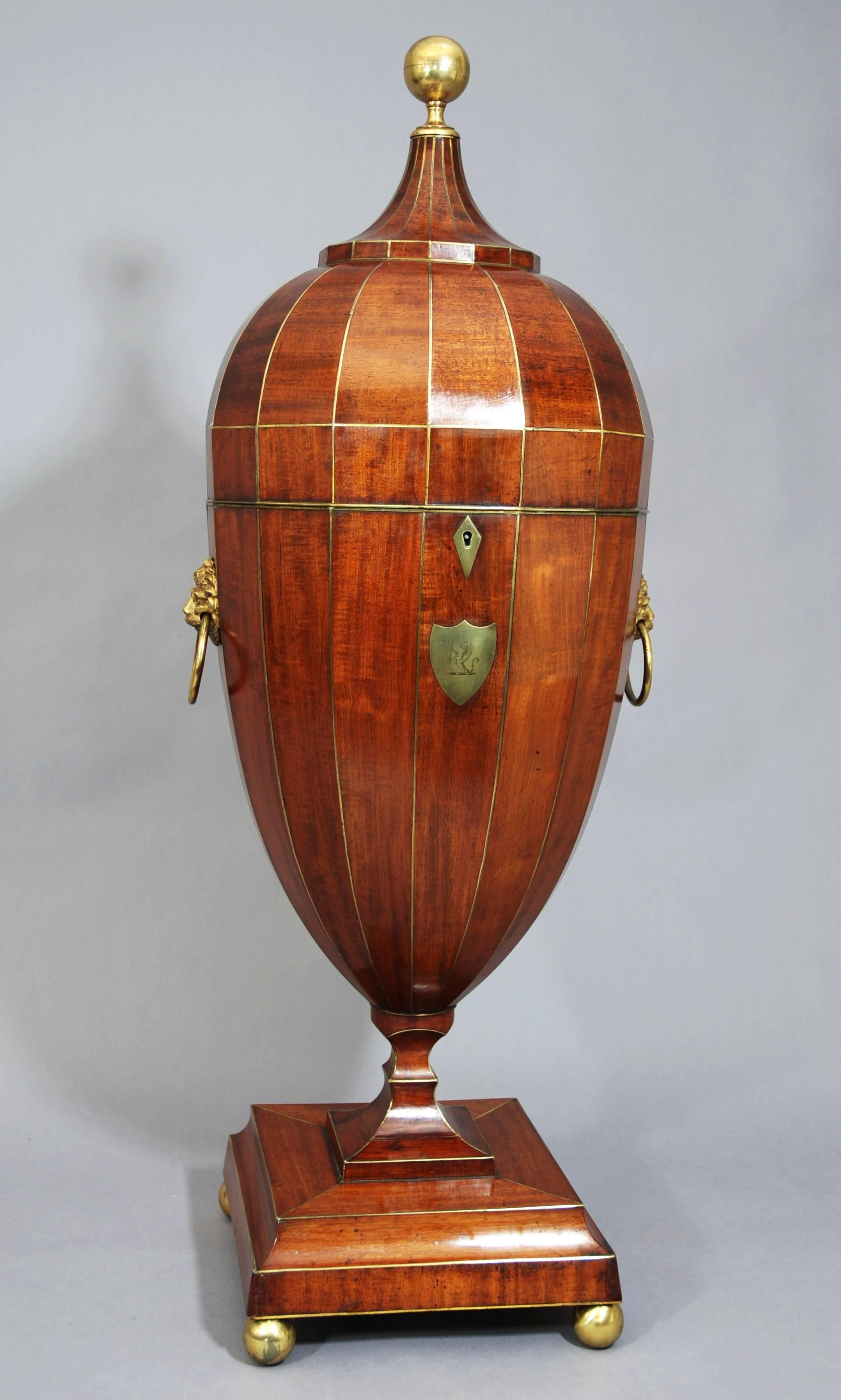 An exceptionally rare superb quality late 18th to early 19th century mahogany cutlery urn with brass line inlay of extremely large proportion, probably English or Russian. 

This piece consists of a turned gilt brass ball finial leading down to a