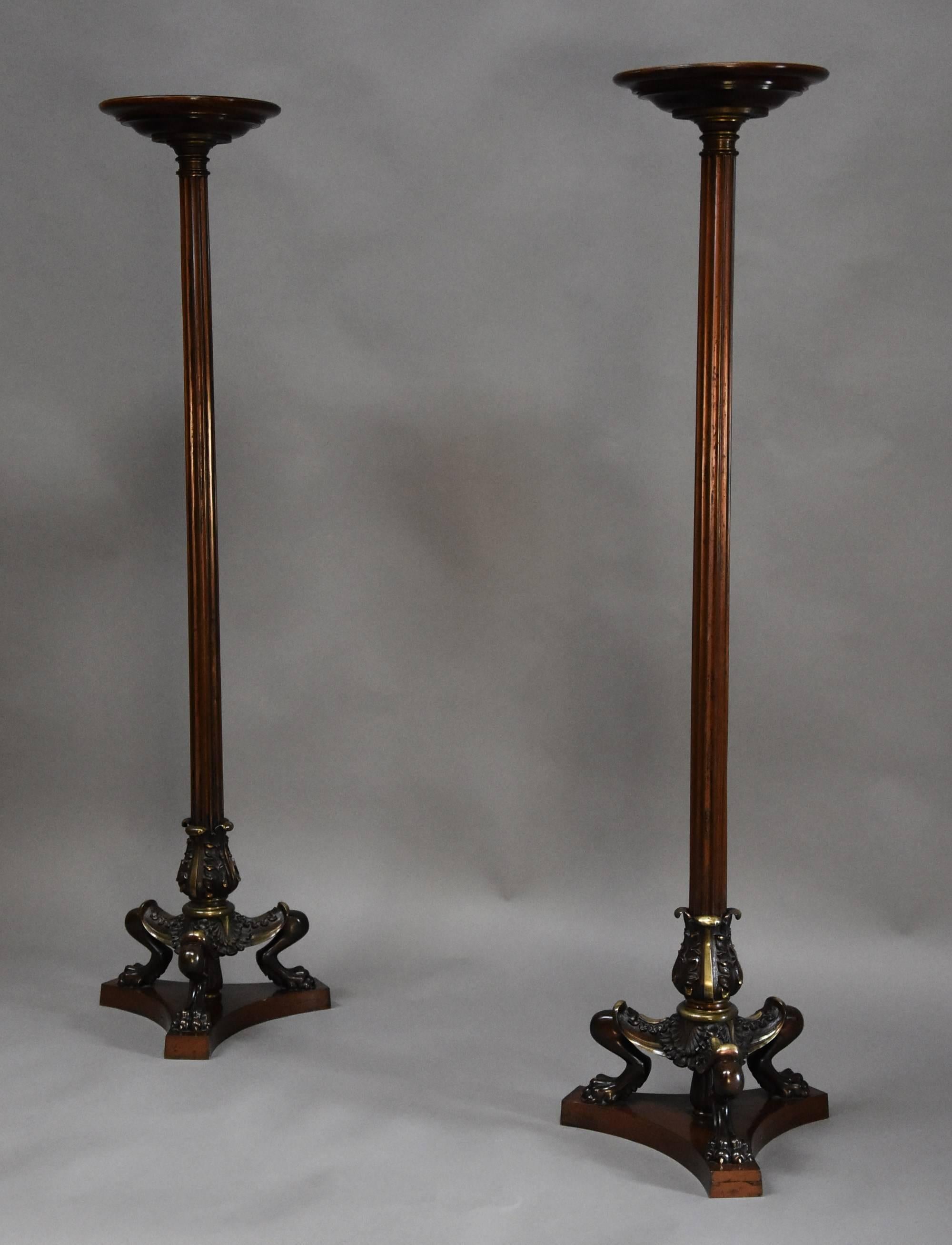 A superb pair of Regency style bronze and mahogany torcheres in the manner of George Smith or Thomas Hope and being in the Egyptian style which was a typical influence in this period.

The torcheres each consist of a circular mahogany top leading