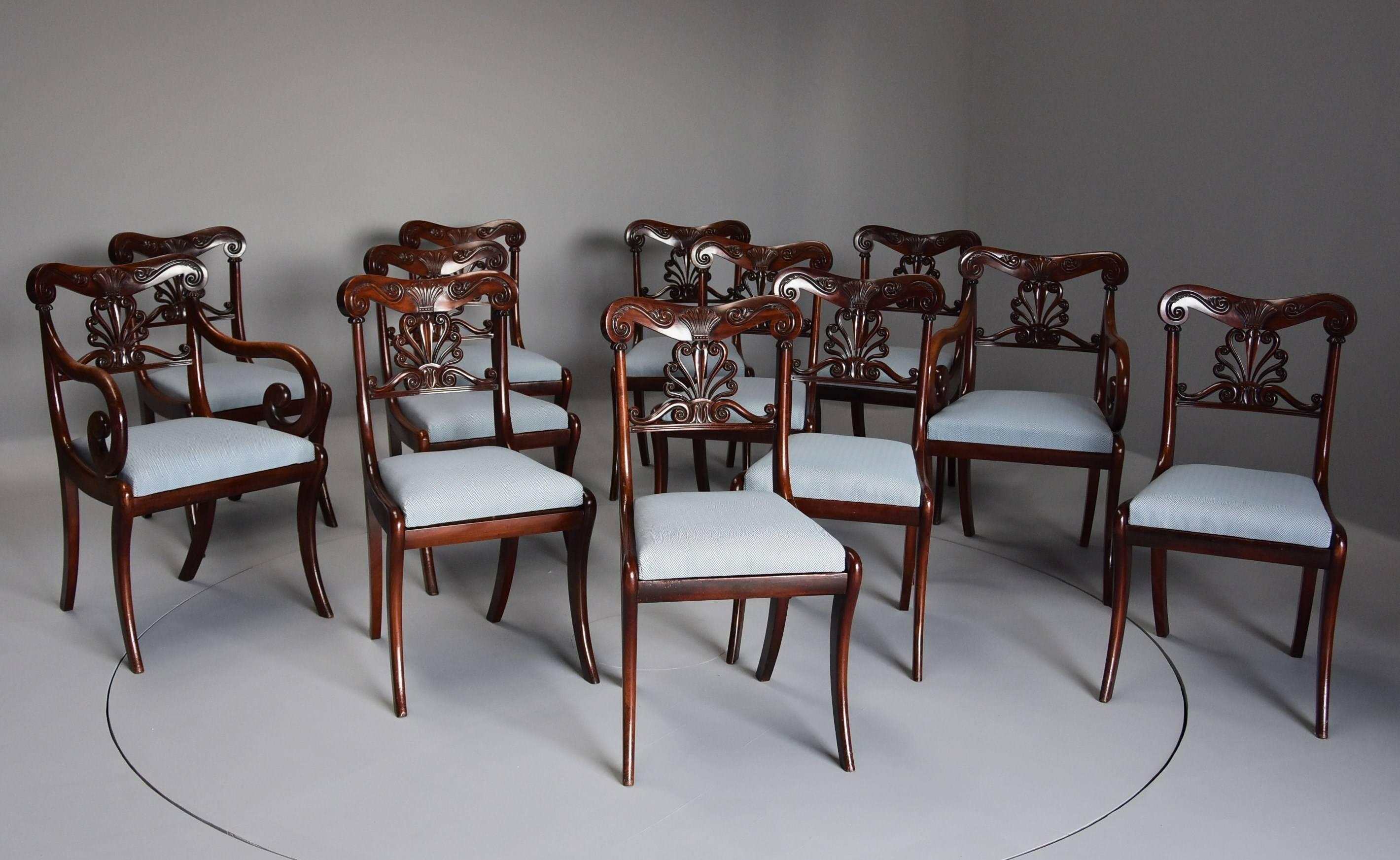 An exceptional set of 12 superb quality Cuban mahogany Regency dining chairs of fine patina and of Gillows quality.

This set of chairs consists of ten single chairs and two armchairs, the shaped top rail being finely carved with stylized scallop