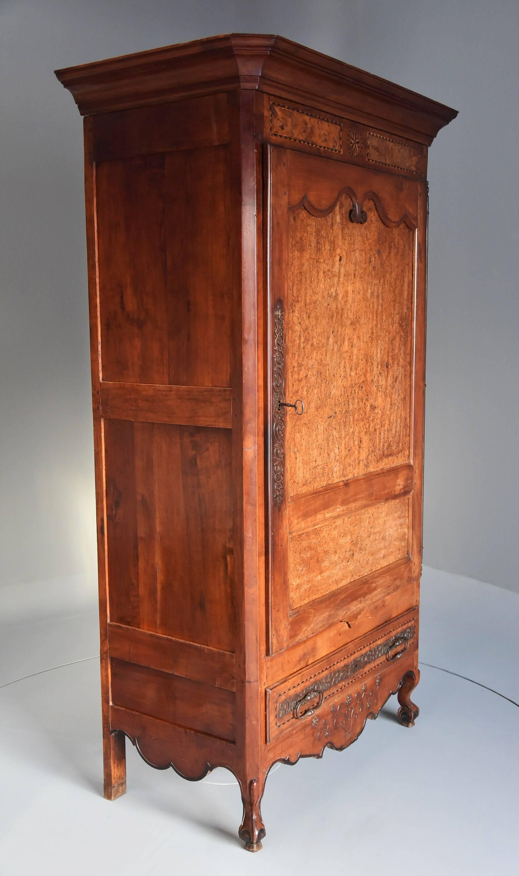 A superb late 18th century Louis XV fruitwood (cherry) and burr elm bonnetiere of superb patina.

The bonnetiere is a tall wardrobe particularly from the Northern area of France and this is a particularly good example.

This bonnetiere consists
