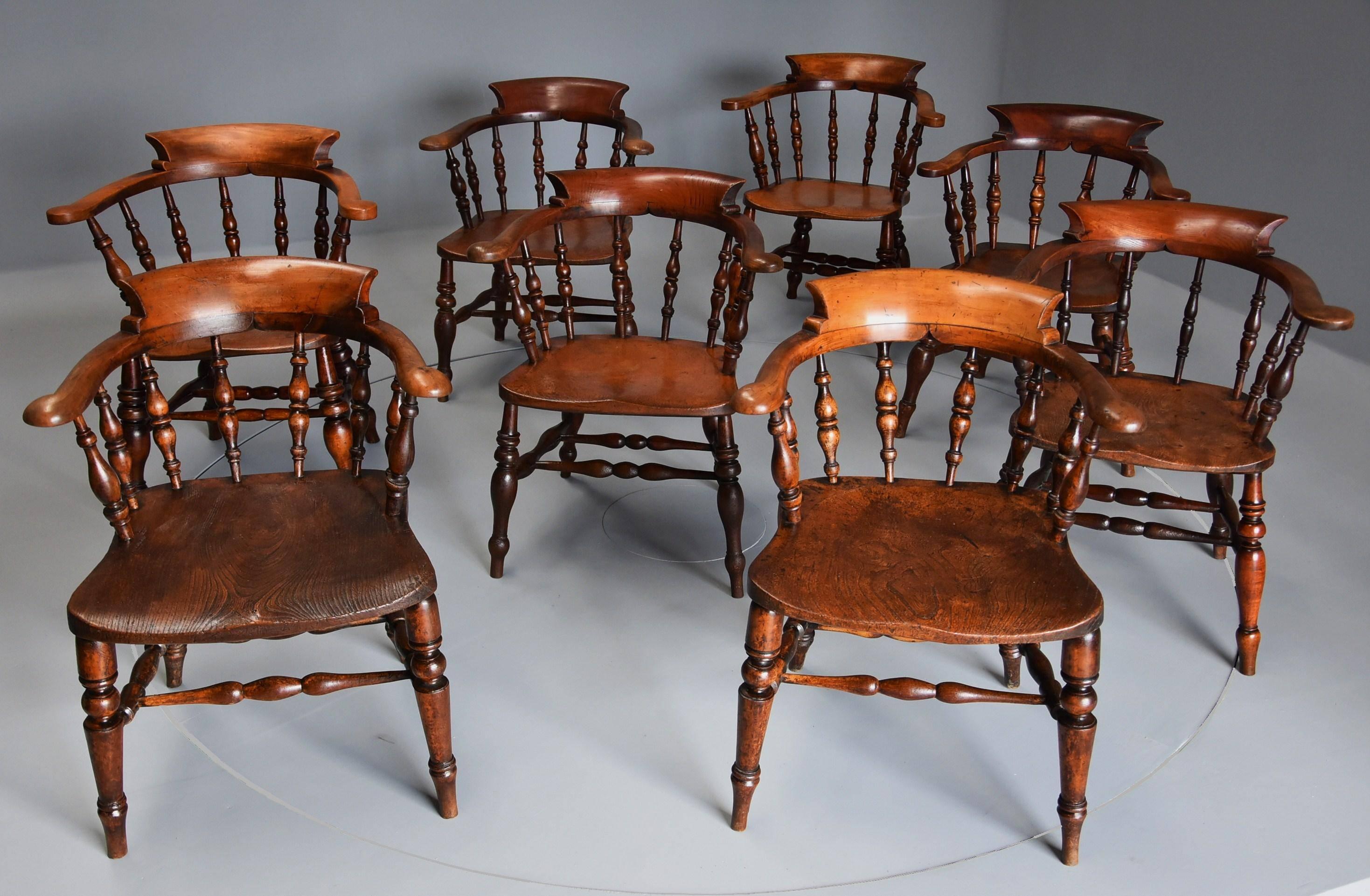 A wonderful large matched set of mid 19th century smokers bow Windsor chairs or office chairs of superb original patina (color).

This matched set consists of two pairs and for additional matched chairs being made of a variety of woods including