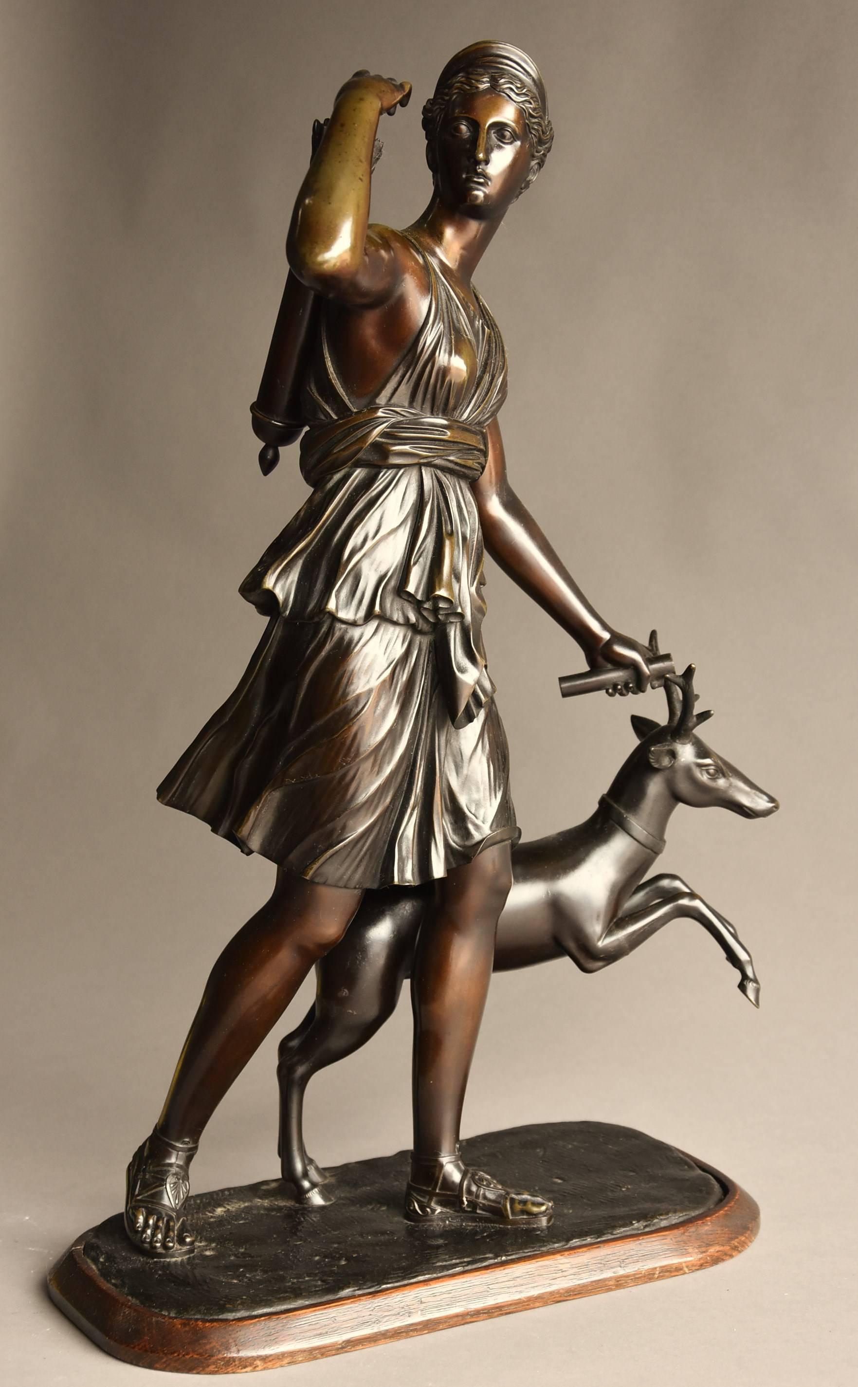 A mid-19th century bronze figure 'Diana of Versailles' or 'Diana the Huntress', after the antique, taken from the original large marble sculpture in The Louvre, Paris.

In this bronze, Diana is portrayed as the huntress with a vibrant, young male