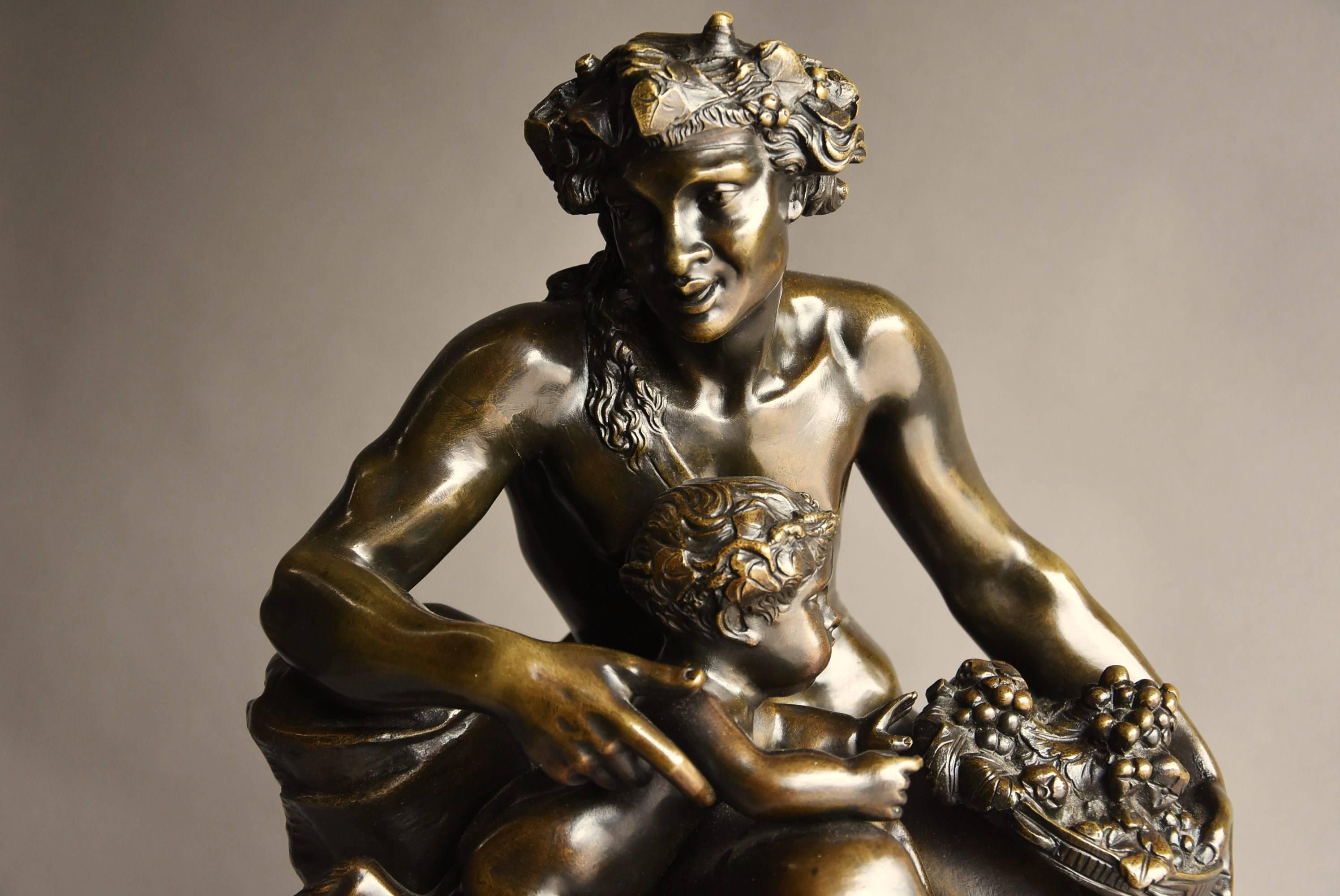 A large mid-19th century, French bronze group of a Satyr and two fauns After Claude Michel Clodian (1738-1814), bearing brass plaque 'Education de Bacchus' and signature to back.

This group consists of a Satyr with small horns to his head, seated