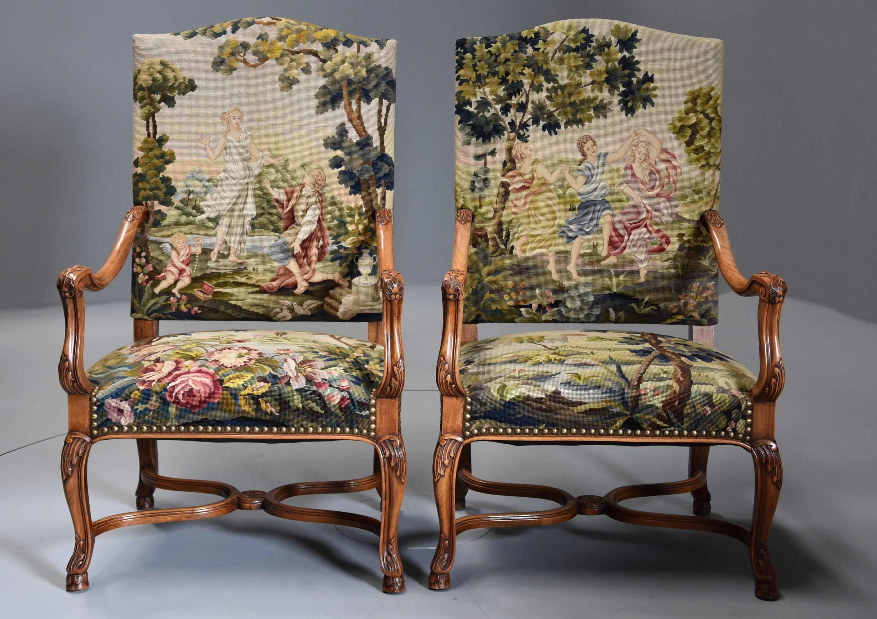 A pair of French late 19th century carved walnut open armchairs (or fauteuils) with tapestry upholstery in the Louis XVth style.

These chairs comprise of a decorative tapestry upholstered back with Classical scenes with a shaped top rail leading