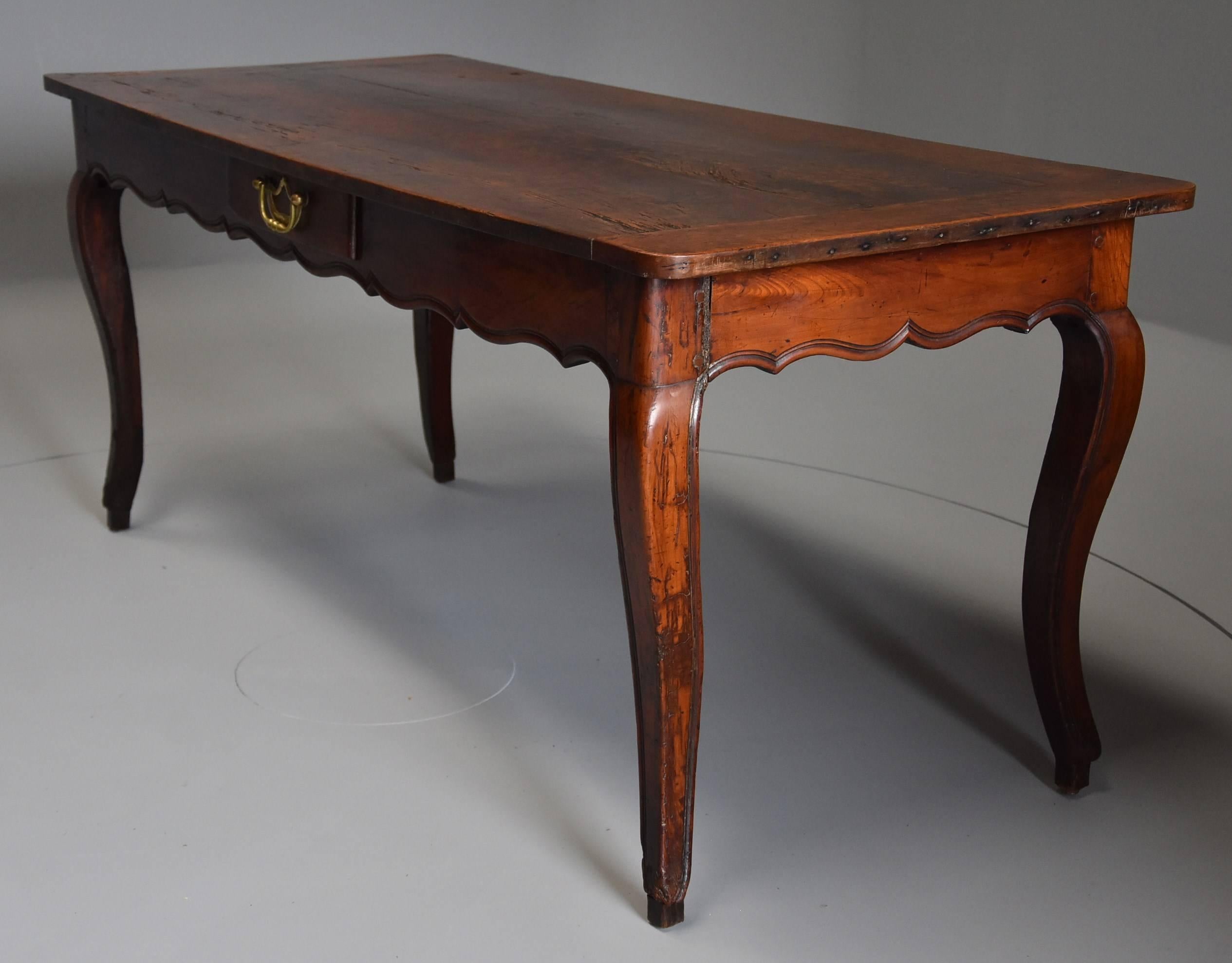A late 18th century French fruitwood (cherry) farmhouse table in original condition with superb patina (color).

The table consists of a three plank top with cleated ends, the top retaining original wear and having a superb patina.

At the end