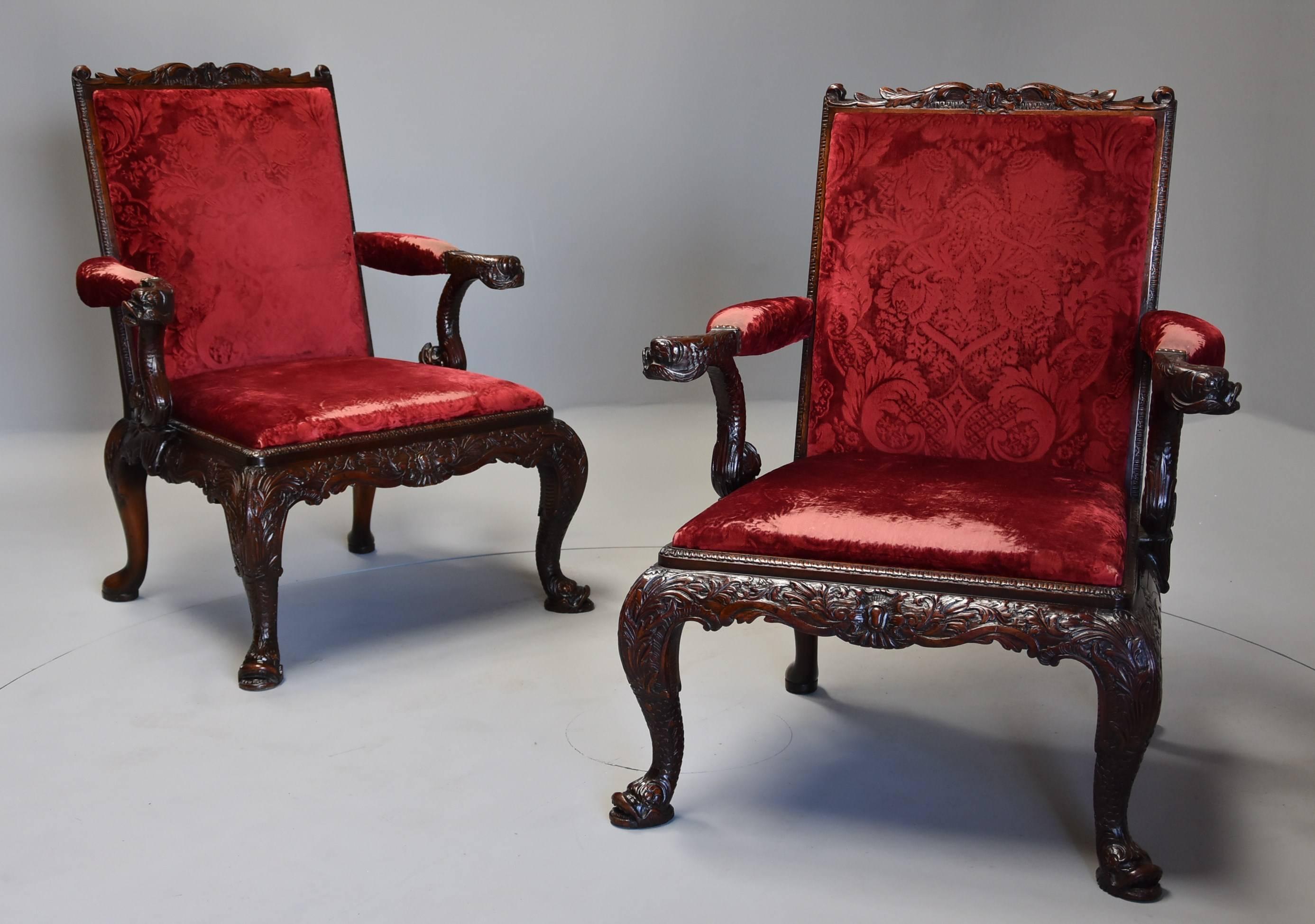 An exceptional pair of late 19th-early 20th century George II style mahogany Gainsborough open armchairs ( or library chairs) of large proportions with possibly the original upholstery.

This superb pair of chairs are copies of an original model