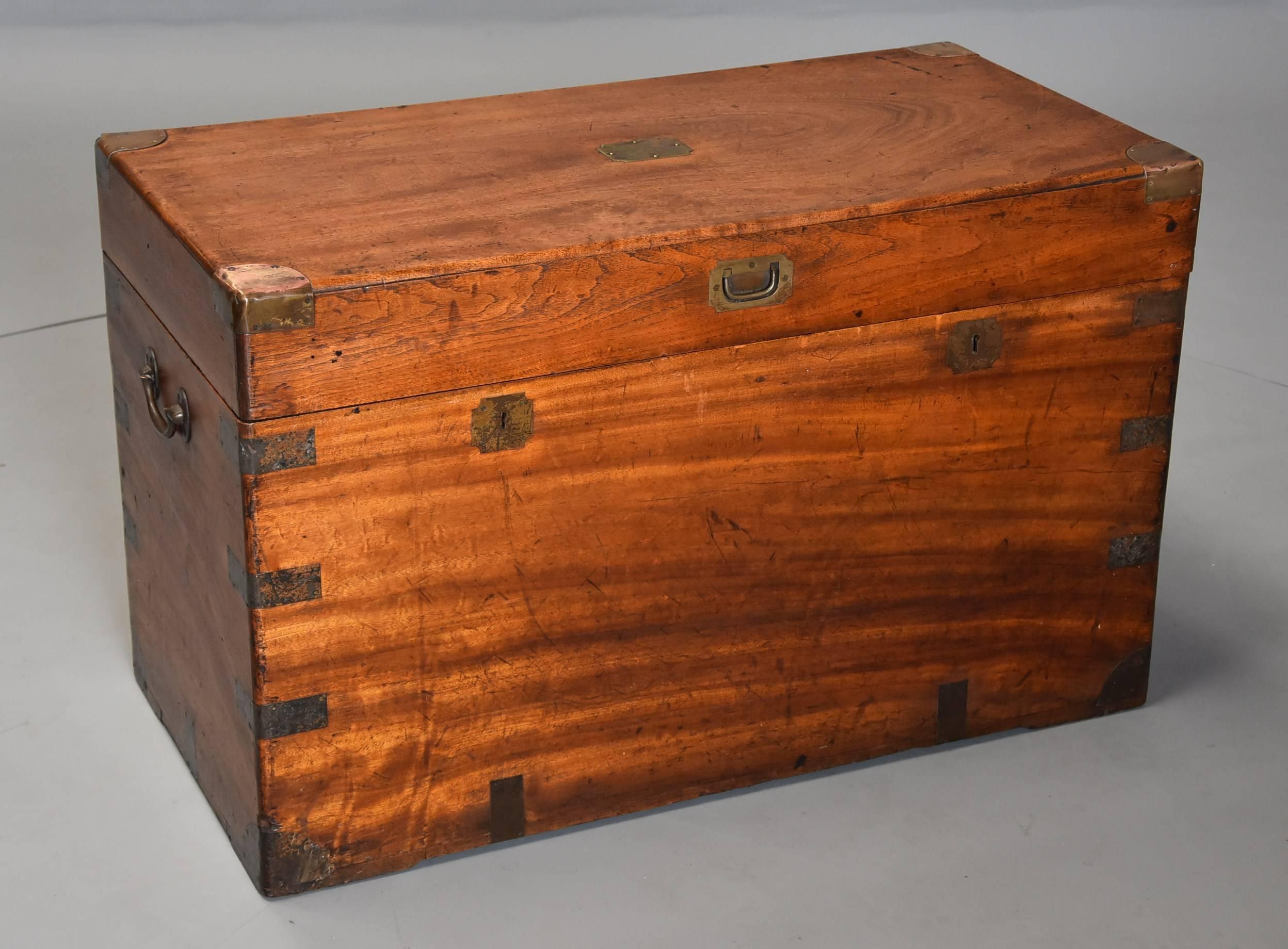 A late 19th century military camphor wood travelling trunk of good patina (color). 

The camphor wood trunk consists of brass trim, a plain brass plate to the top, recessed handle, carrying handles and double lock plates to the front. 

The top