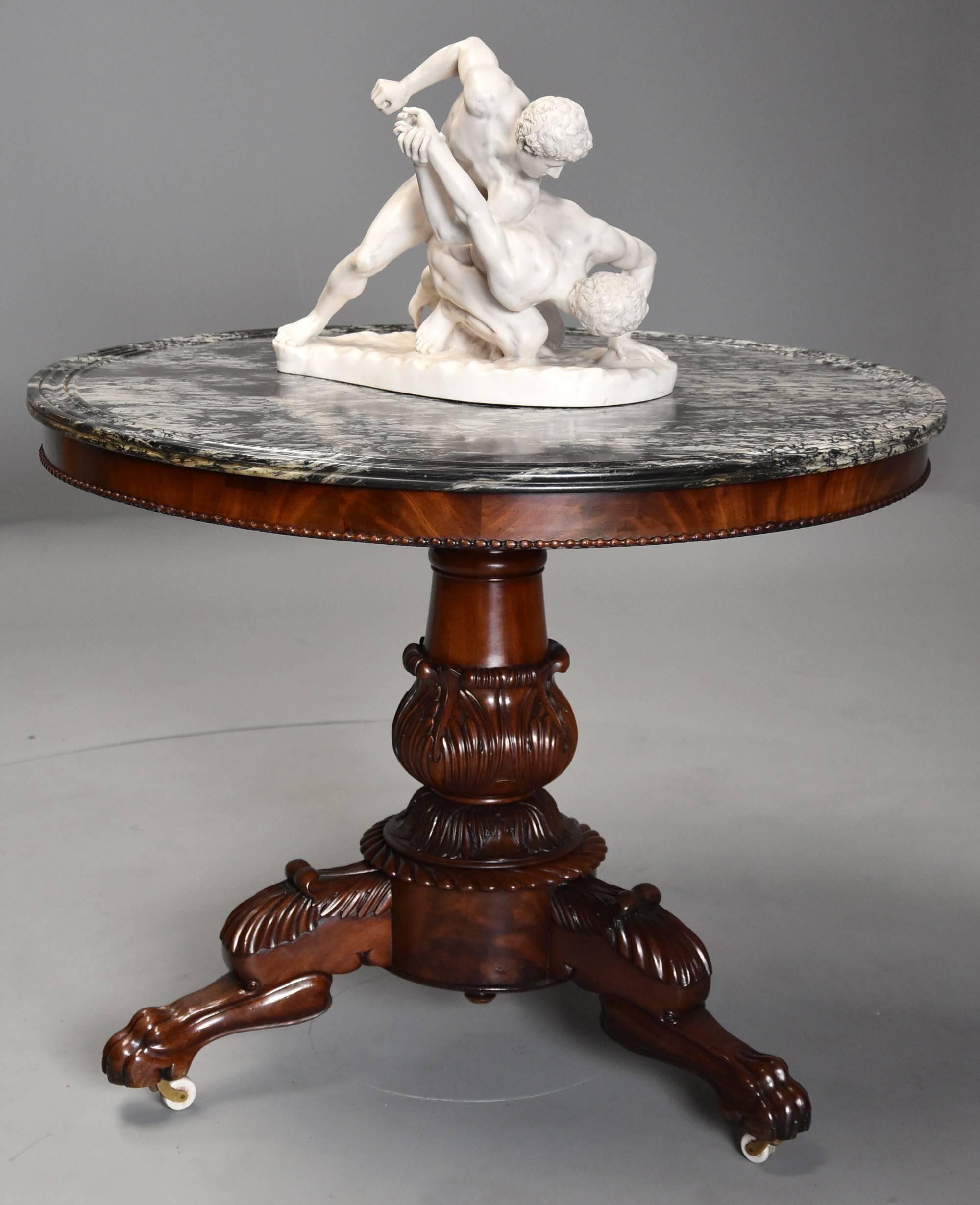 A 19th century (circa 1830) French mahogany gueridon table with original black and white veined marble-top, possibly Vert Maurin.

The table consists of the original marble-top, this being a black and white veined marble, possibly Vert Maurin,