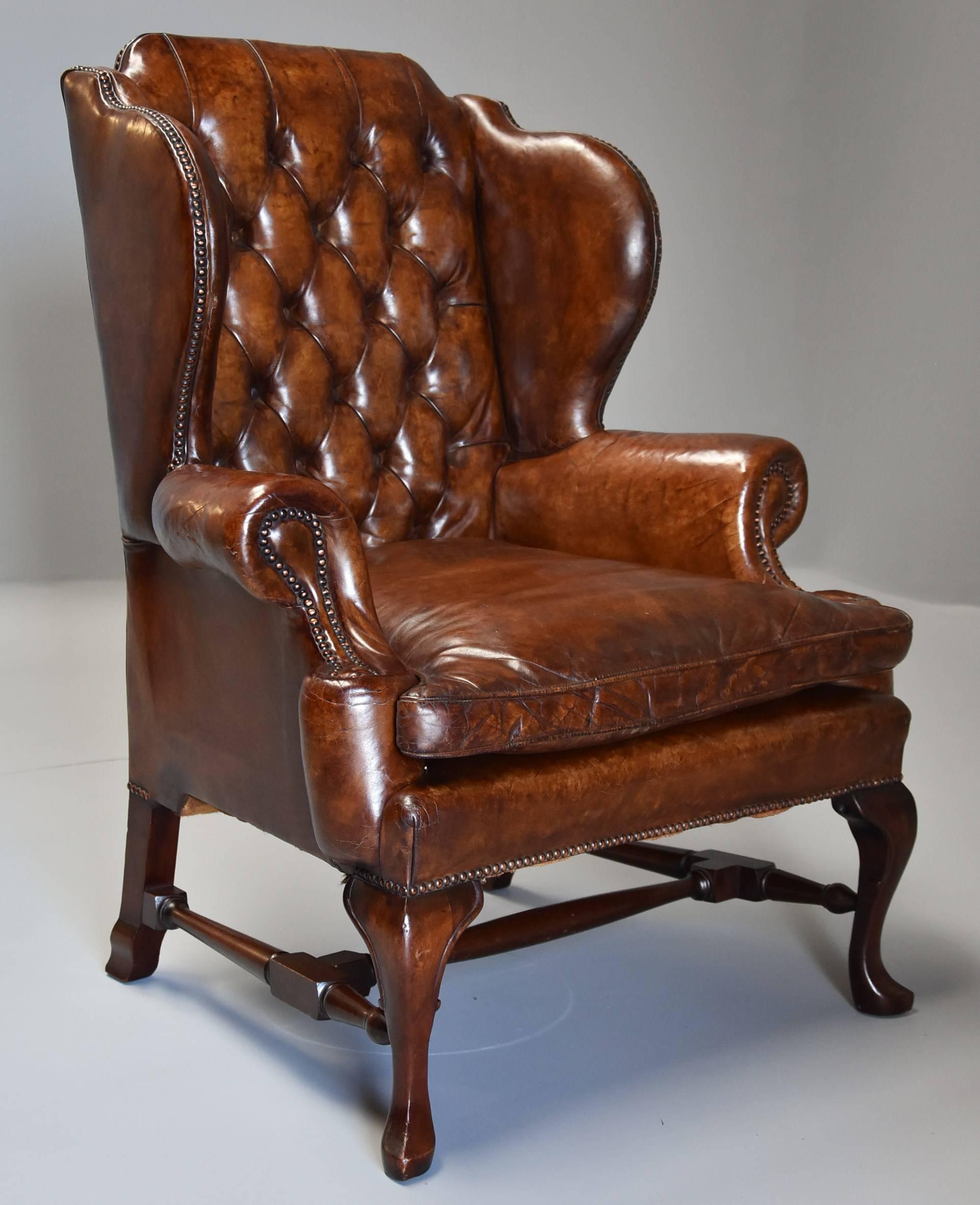 English Early 20th Century Georgian Style Deep Buttoned Brown Leather Wing Armchair