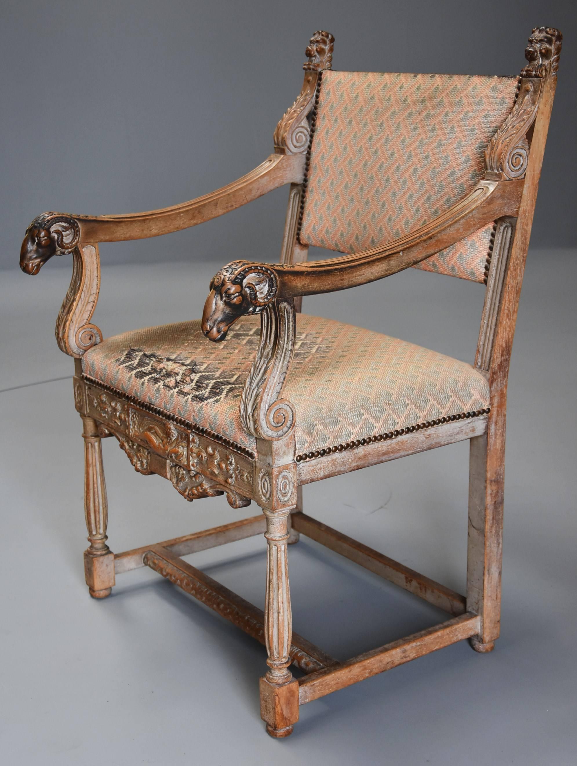 A late 19th century highly decorative French limed oak armchair in the Renaissance style, the rams head armrests with superb patina and retaining original tapestry upholstery (see below regarding re-upholstery).

This armchair consists of two
