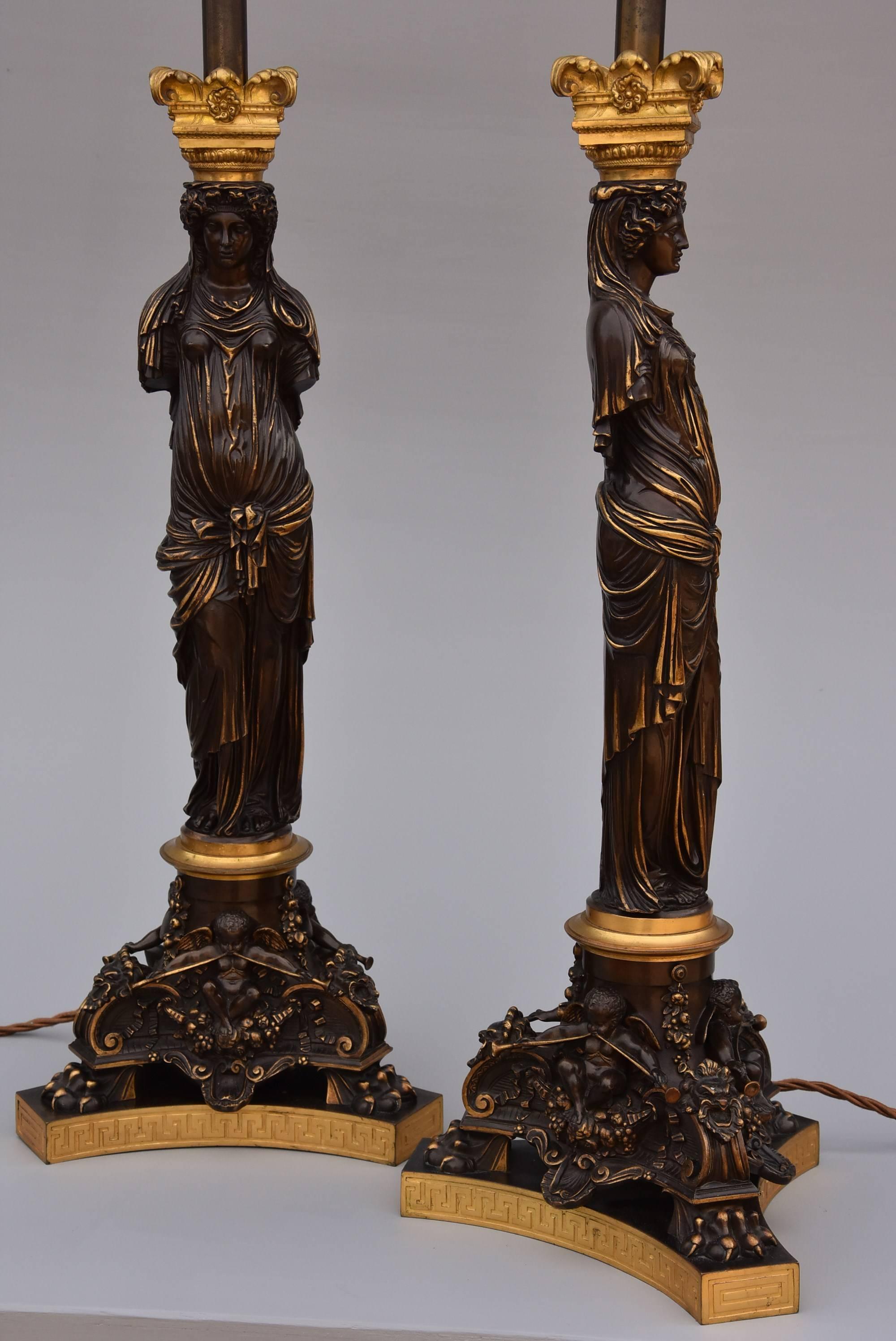 A large pair of late 19th century superb quality bronze and gilt bronze table lamps, signed Barbedienne.

This pair of lamps are in the form of antique caryatids after a model of statues in ‘The Carytids Room’ in The Louvre, Paris.

The lamps