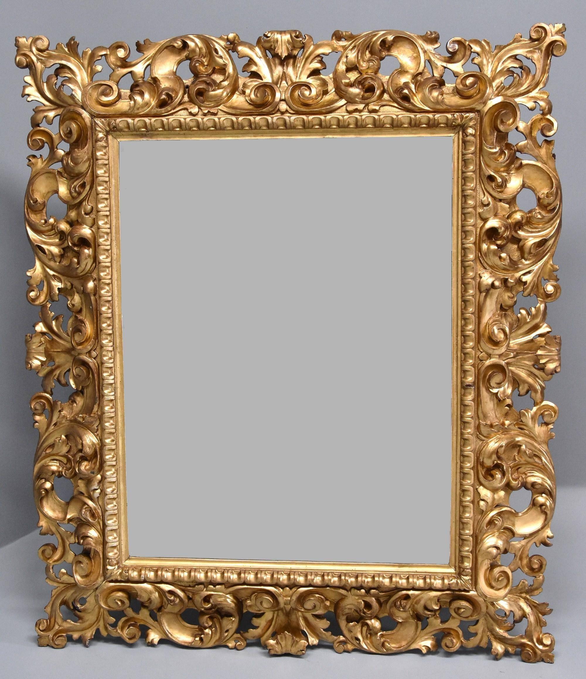 A superbly carved and highly decorative large late 19th century Florentine carved giltwood mirror.

This mirror consists of a superbly carved gilt wooden frame of scrolling acanthus leaf decoration in very good original condition with very small