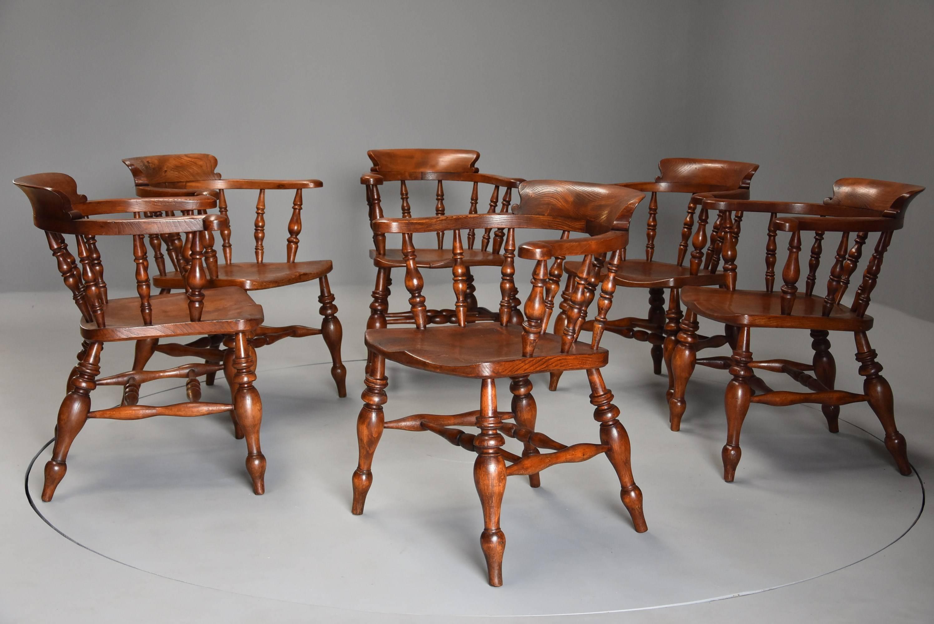 A wonderful true set of six mid-19th century nicely figured elm Smokers bow Windsor chairs or office chairs of good color with stamped initials ‘FW’ possibly from the Nottinghamshire area, England, UK.

The chairs consist of a deep, shaped back