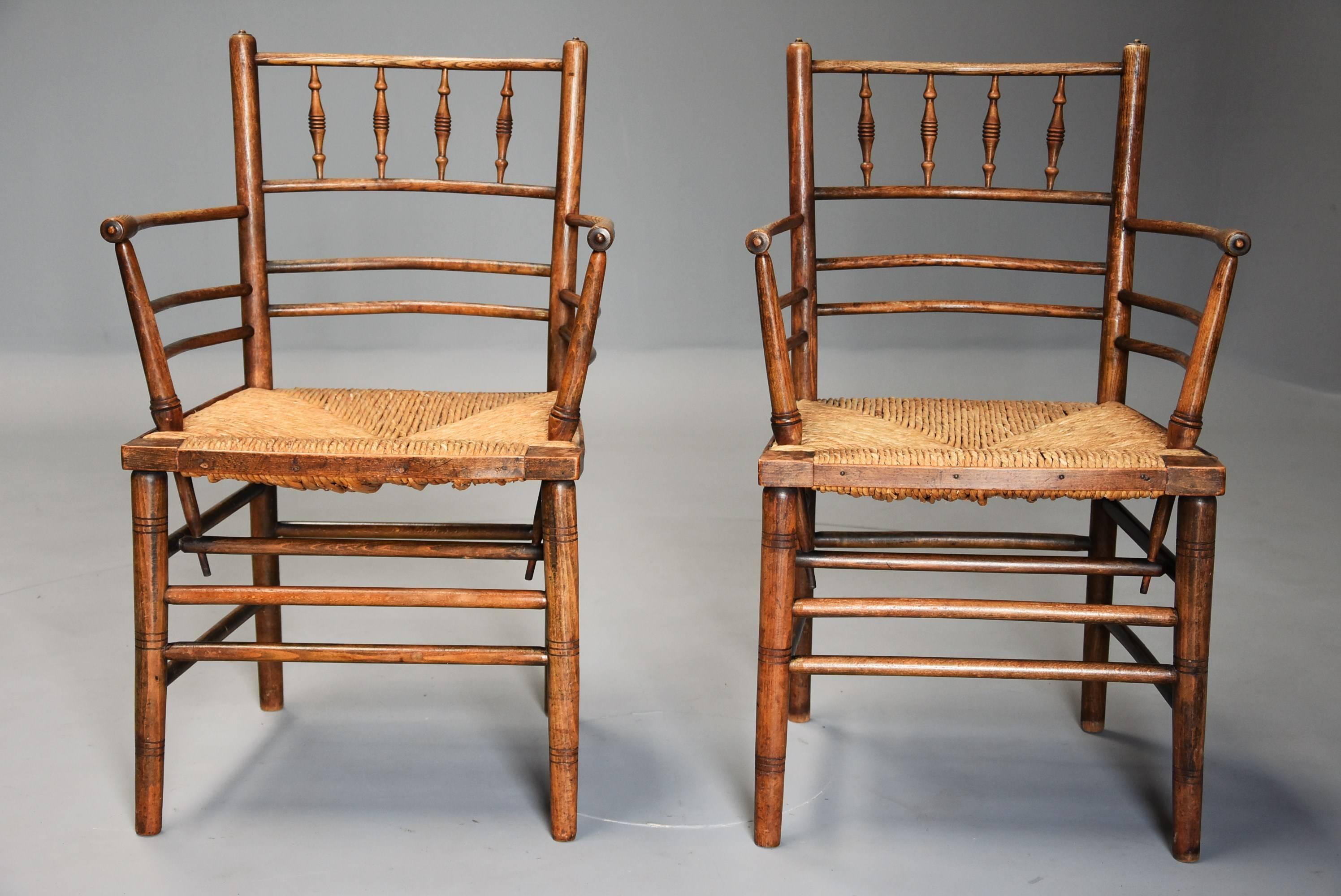 A pair of ash and beech Morris & Co. Sussex armchairs designed by Phillip Webb.

This pair of armchairs are unusual as they are not ebonized which is often the case with this design of chair, instead the backs, arms and back legs are ash, the