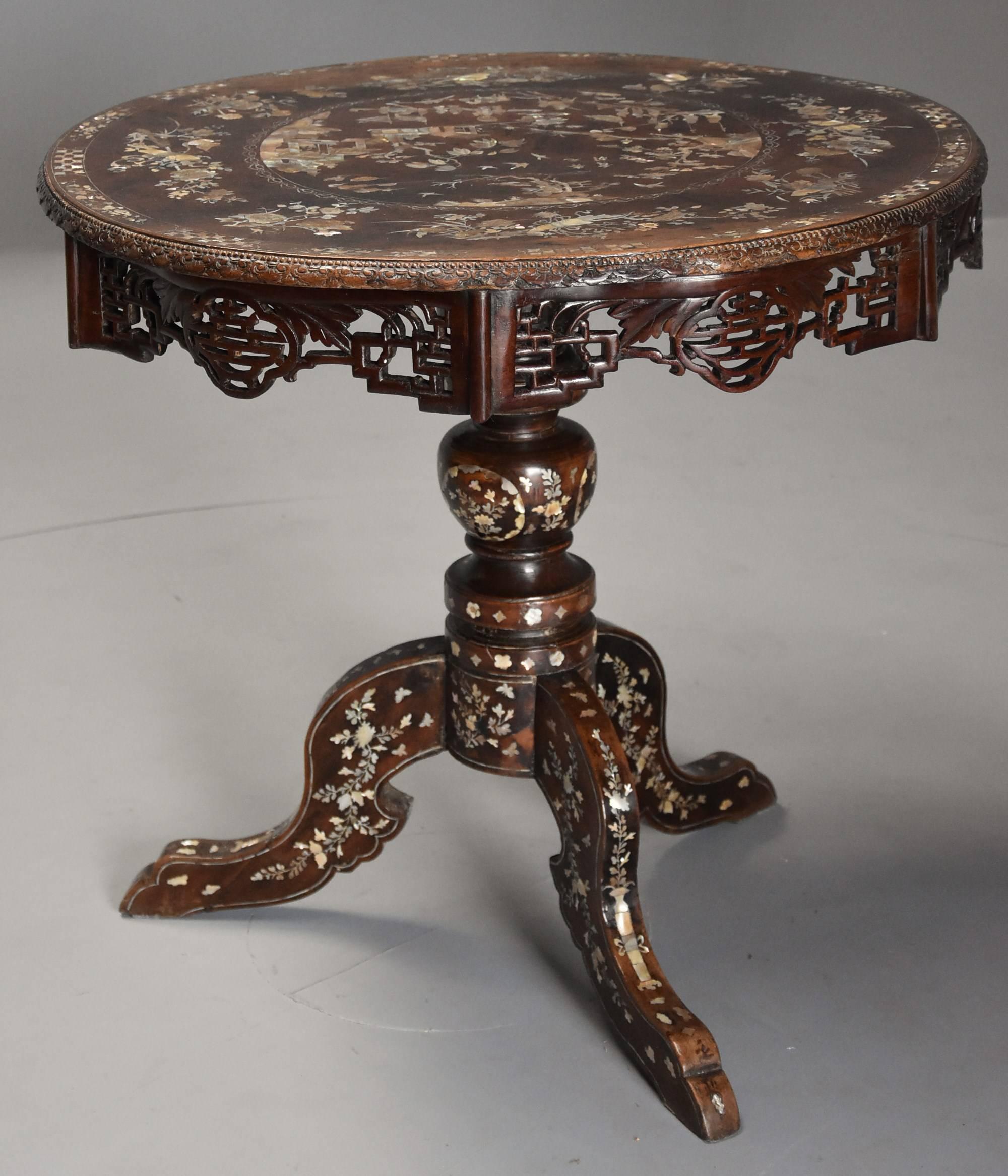 A highly decorative late 19th century Vietnamese hardwood veneered circular centre table profusely inlaid with superb quality engraved mother-of-pearl decoration.

This table consists of a circular burr hardwood veneered top with central circular