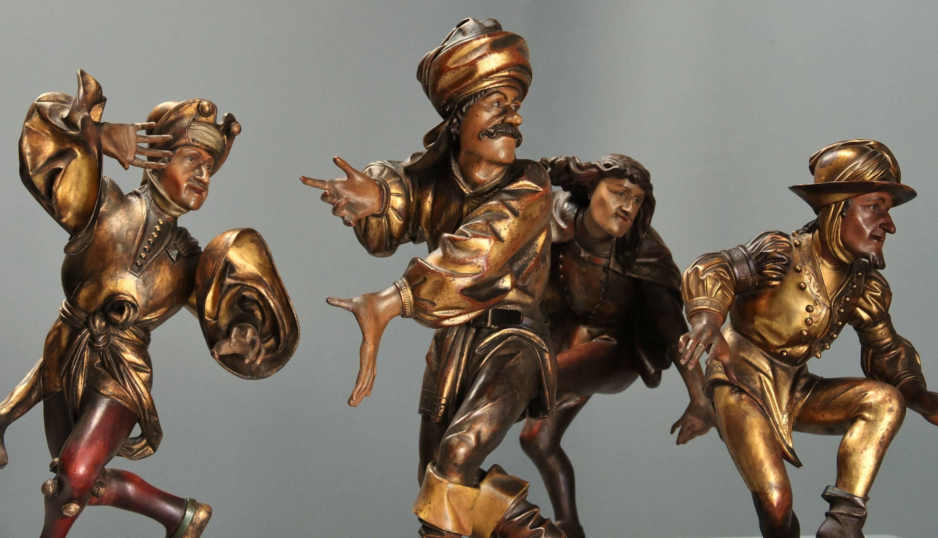 A superb set of four mid 19th century large giltwood and polychrome carved wooden figures of Medieval Morris Men after the original set of sixteen made by Erasmus Grasser in 1480.

Each carved giltwood figure being richly & finely decorated with