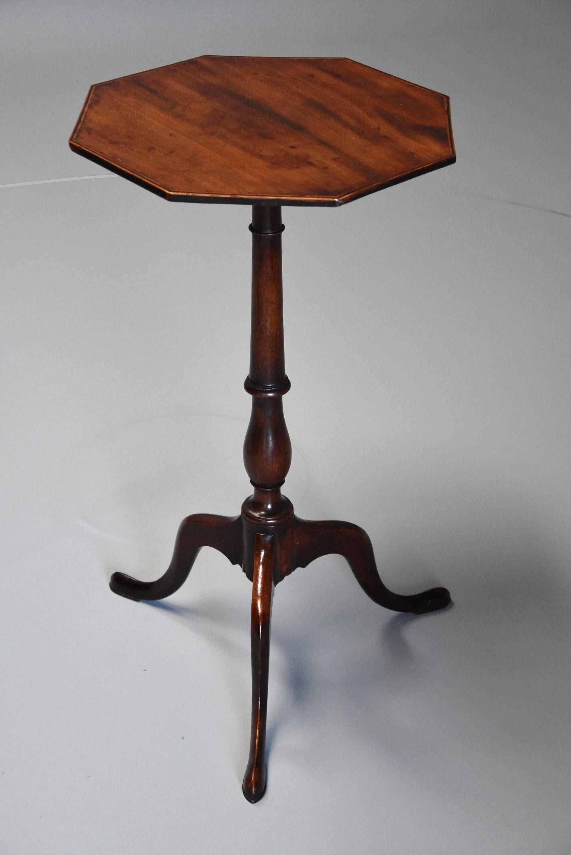 An elegant 18th century mahogany occasional table of octagonal form and Fine patina.

This table consists of a solid mahogany octagonal top with boxwood and ebony stringing to the outer edge.

This leads down to an elegant baluster turned column