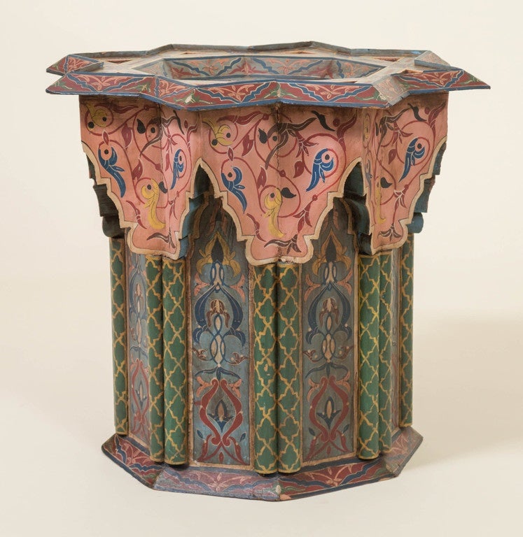 Kashmir/North Indian taboret stand. Complex octagonal juxtaposed form with recessed panels, moldings, columns and miters. Exotic polychromed exacting free hand-painted surface. Very strong build with a bold architectural stance. 
Excellent as a