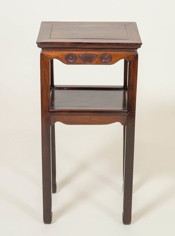 Chinese tea table/stand of rosewood, (Hong mu). Fully carved apron below the top of fans flanked by flowers. Another shelf, table surface below the top. Good deep color and tight joins. Versatile size. Circa 1900.