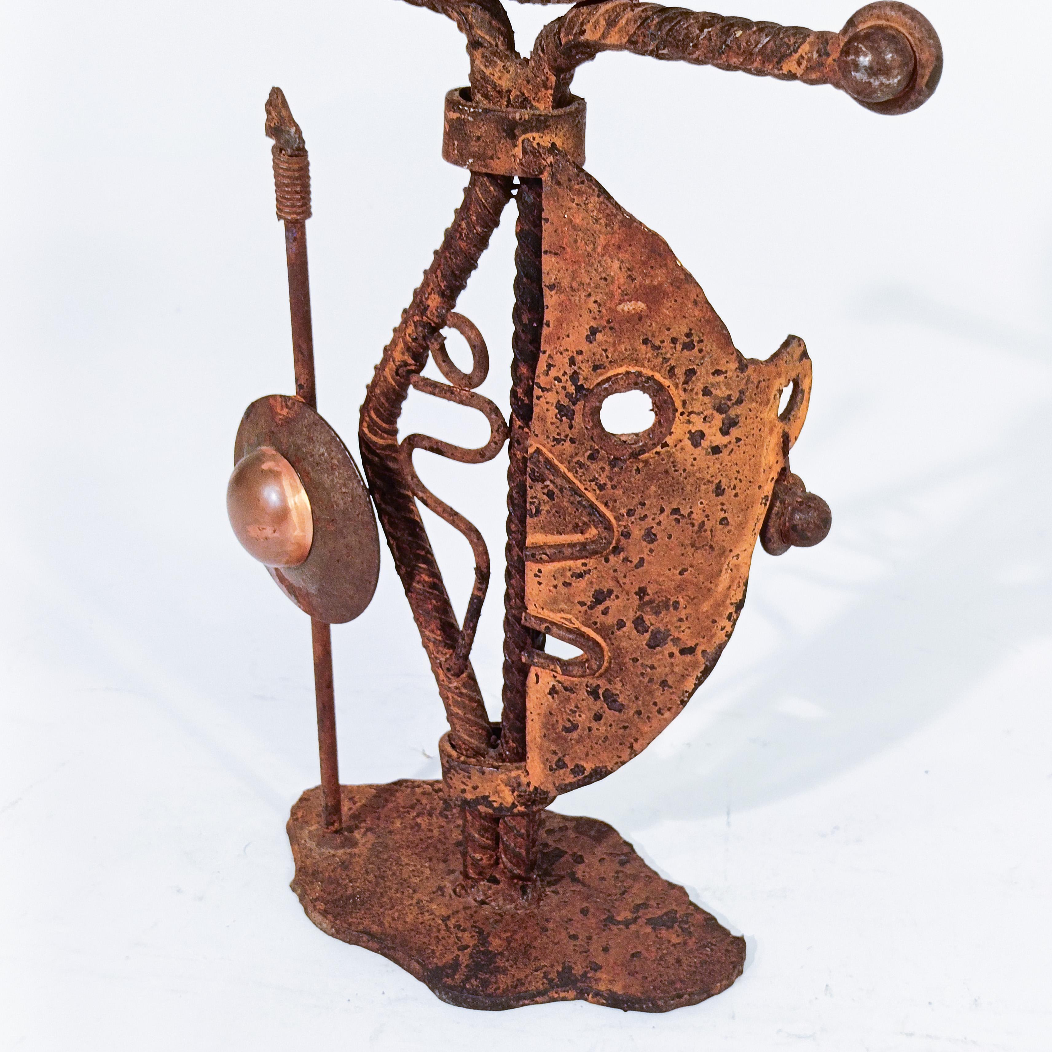Late 20th Century Brutalist style. Hand made ethnic candlestick in iron, Denmark, 70s For Sale