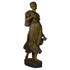 Statue en terre cuite femme porteuse d'une jarre signée XX's