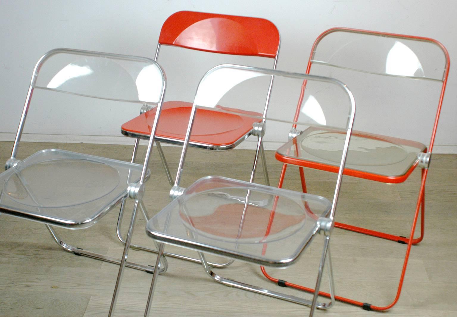 Pair of iconic Italian late 1960s Lucite Plia folding chairs, one red and one red Lucite also available as single.
Marked see photos.
