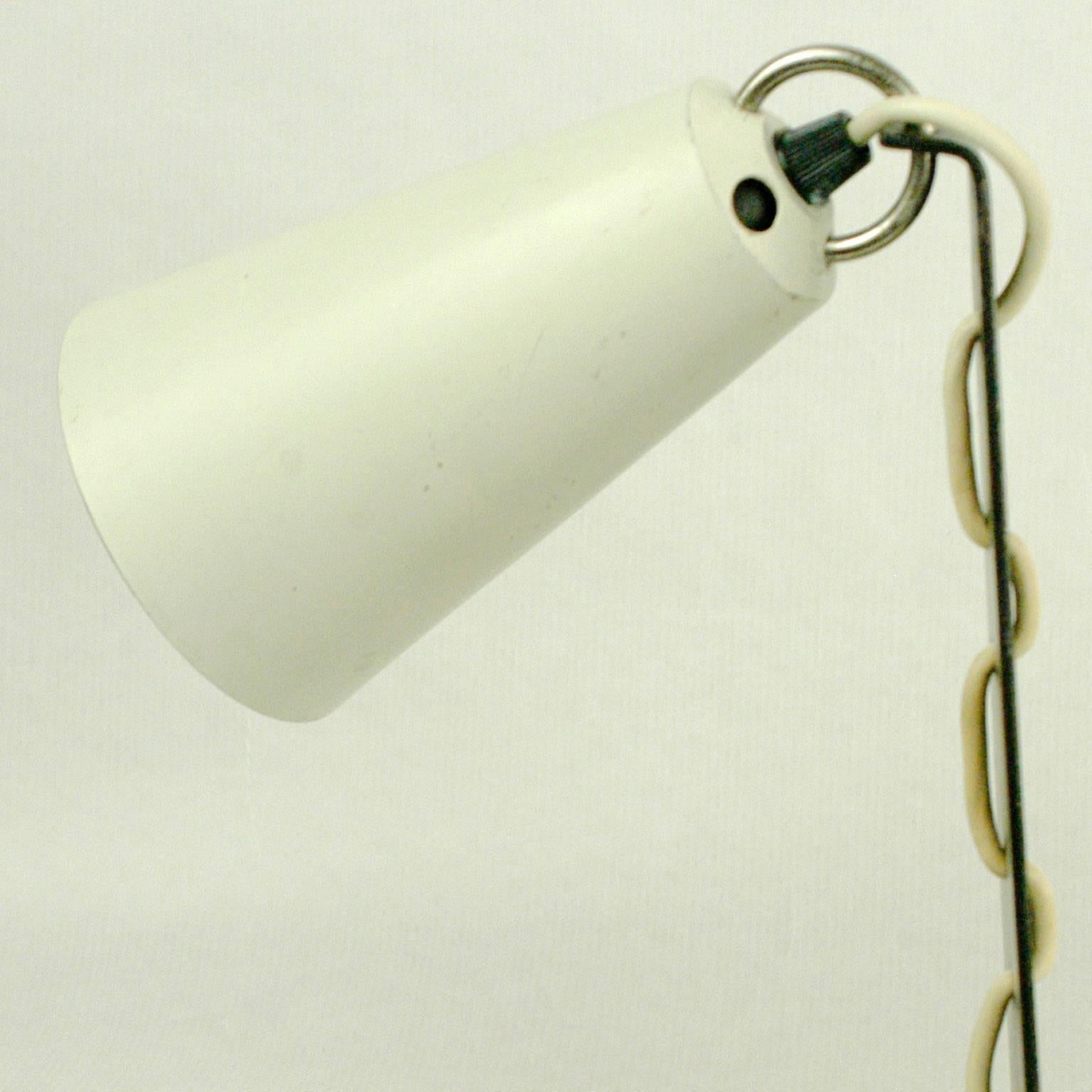 Rare and charming  Austrian Mid-Century Modern table light, model no. 1246, designed and manufactured by J.T. Kalmar Vienna.
It features a adjustable shade in every position, all in very nice original condition with some slight signs of wear.