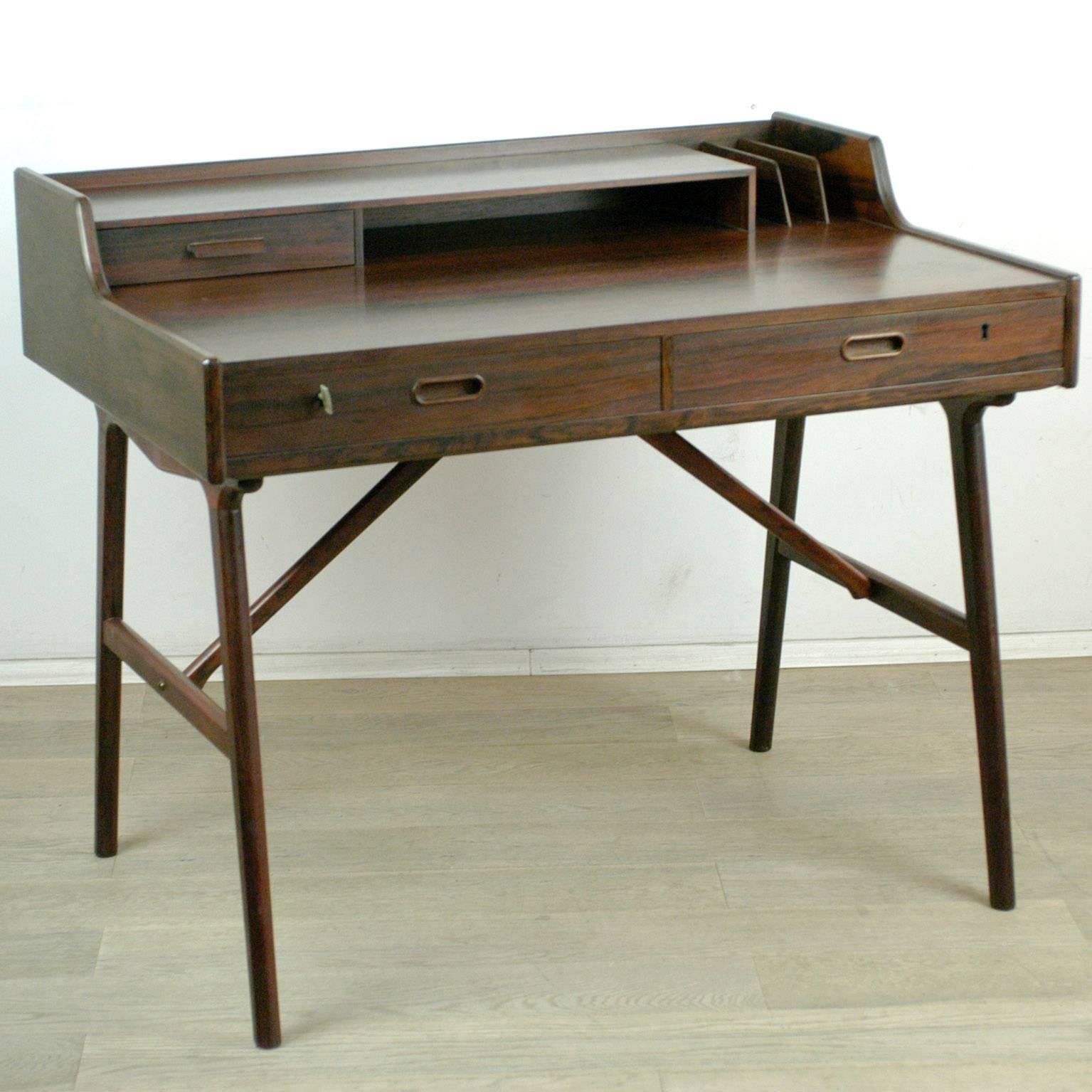 Wonderful Scandinavian desk with spraying legs, table top with drawer, storage shelf and folder, marked Danish design and manufacturers stamp on the underside. All beautiful original condition.
Mod no 56.