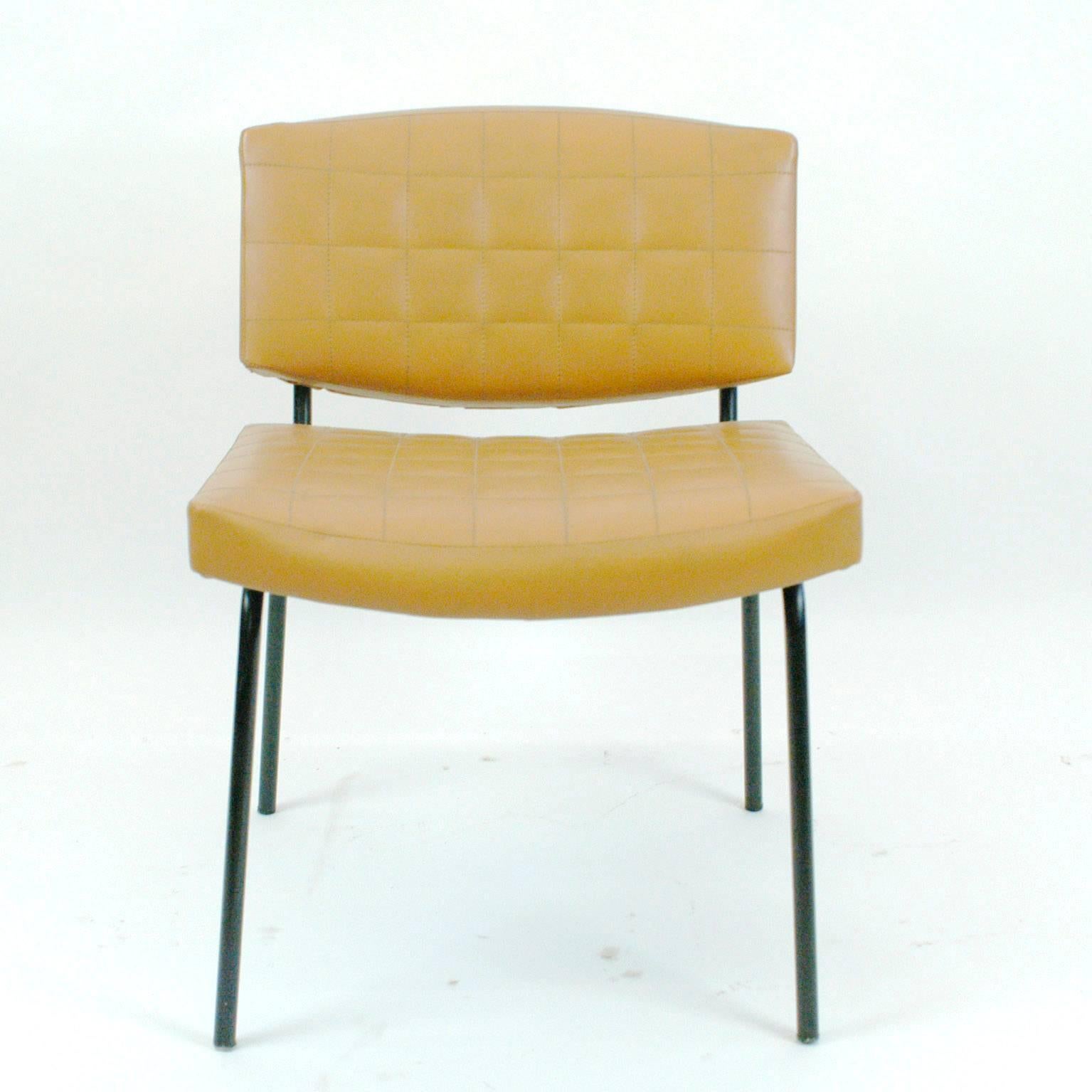 Set of comfortable Midcentury chairs with original cognac skai upholstery and black lacquered metal base. Original 