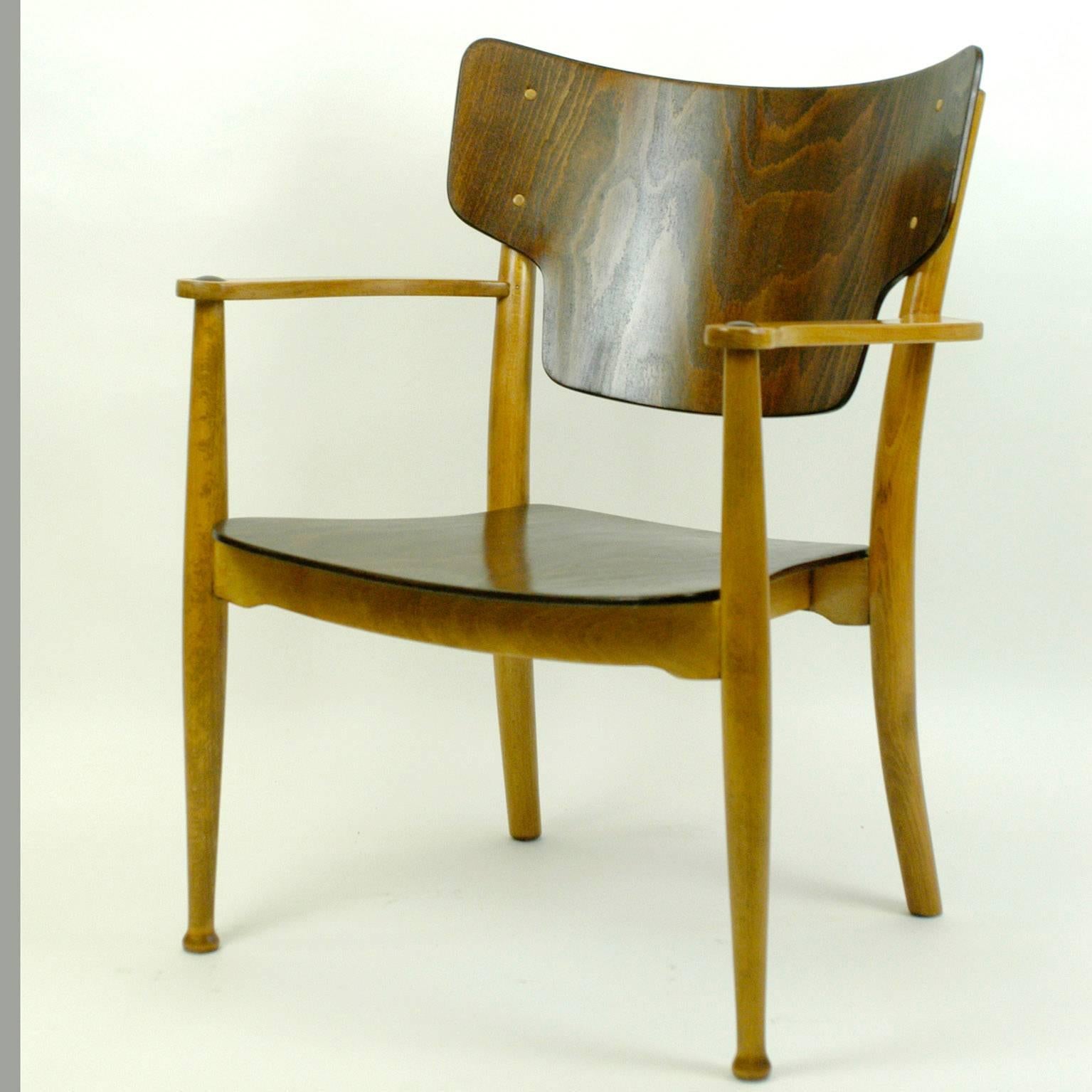 Early Scandinavian Modern beech armchair with plywood seat and back.
Usually produced by Fritz Hansen, this one manufactured by Thonet who produced them as well for some years