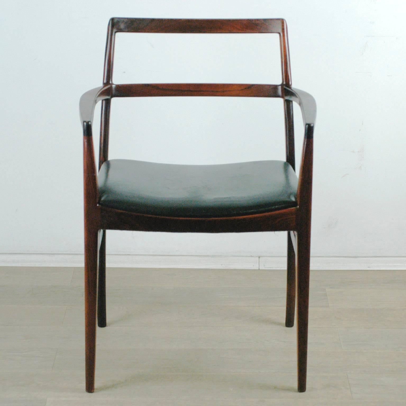 Danish Modern rosewood armchair with original black leather seat.
