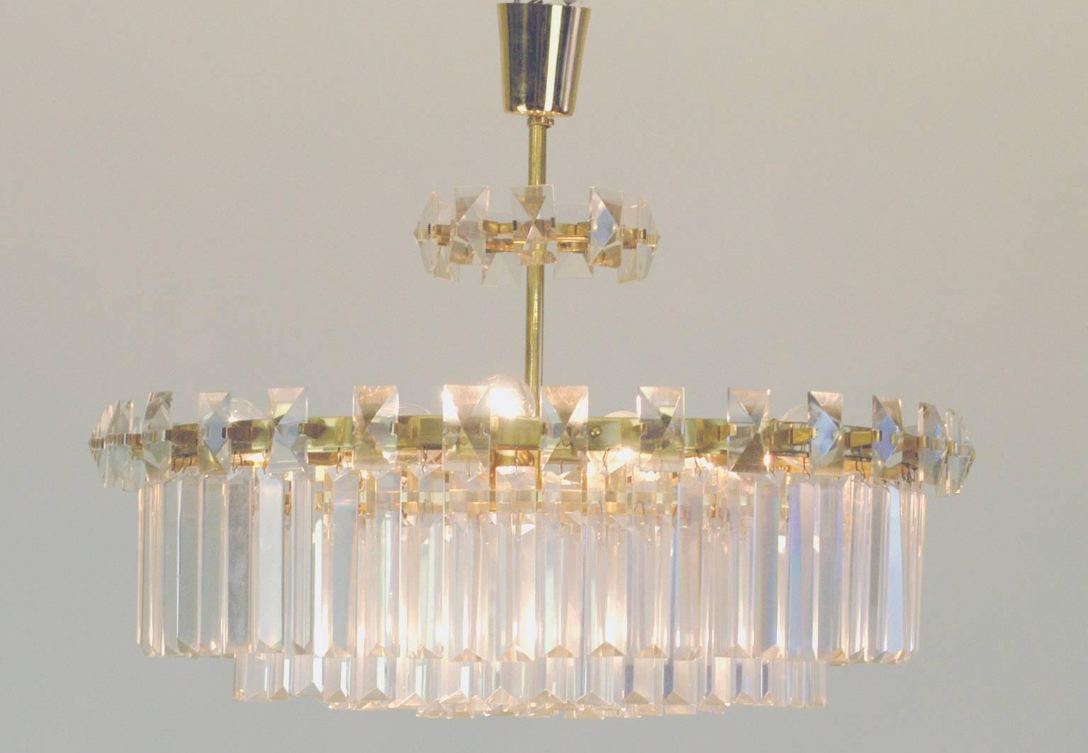 Excellent  Austrian Midcentury brass and glass chandelier designed by Oswald Haerdtl with twelve-light sockets (2 E27, 10 E14).