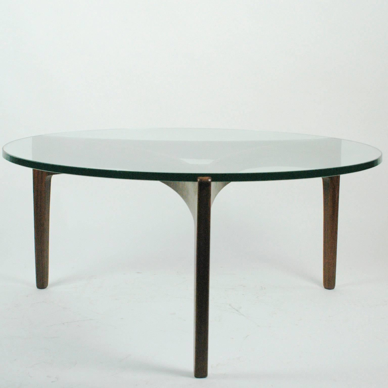 Excellent three legged Scandinavian Modern glass and rosewood coffee table.