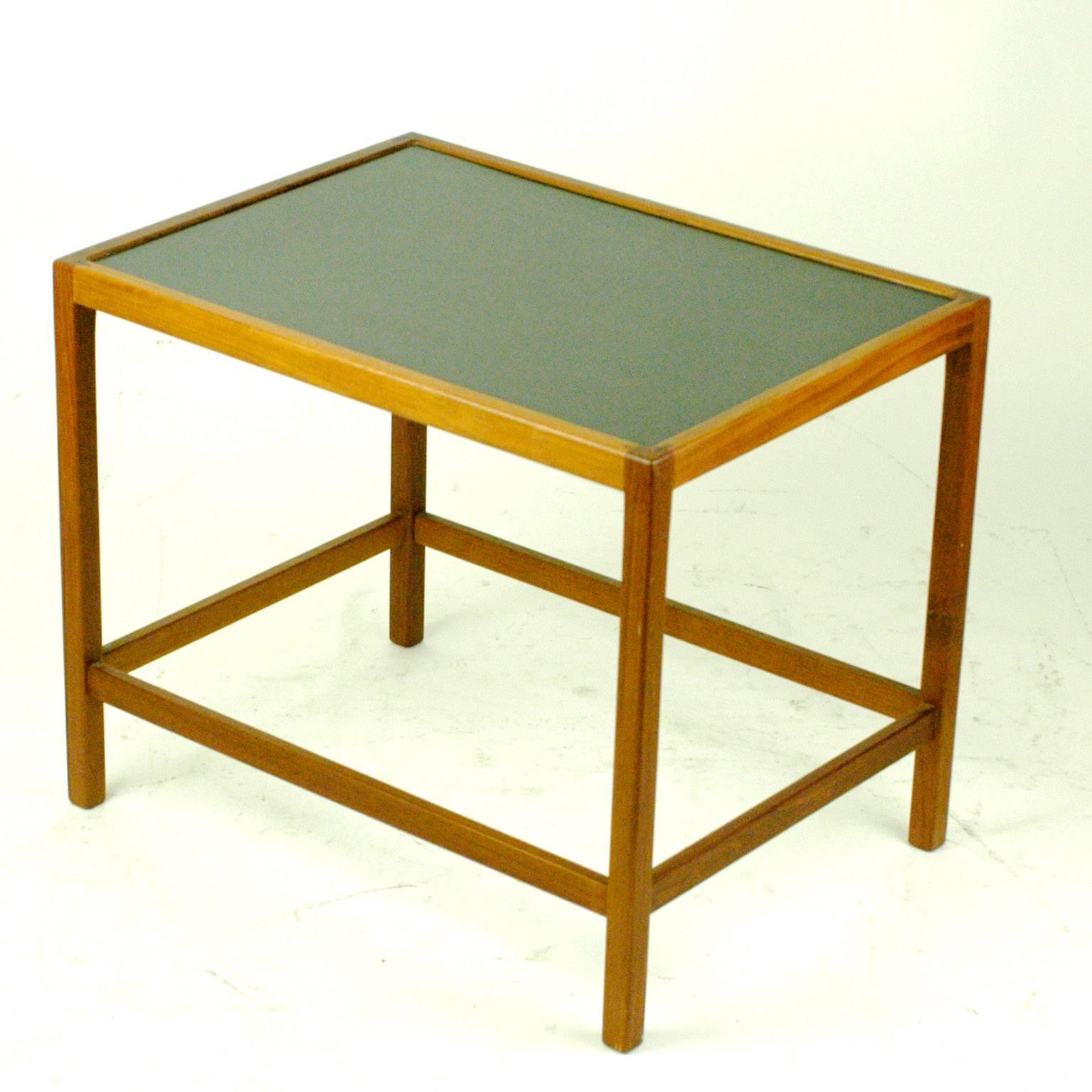 Danish 1960s teak side table with formica top and beautiful handcrafted details. Because of its shape, slim proportions and excellent quality of handcraft the table is attributed to Ejner Larsen and Aksel Bender Madsen.
