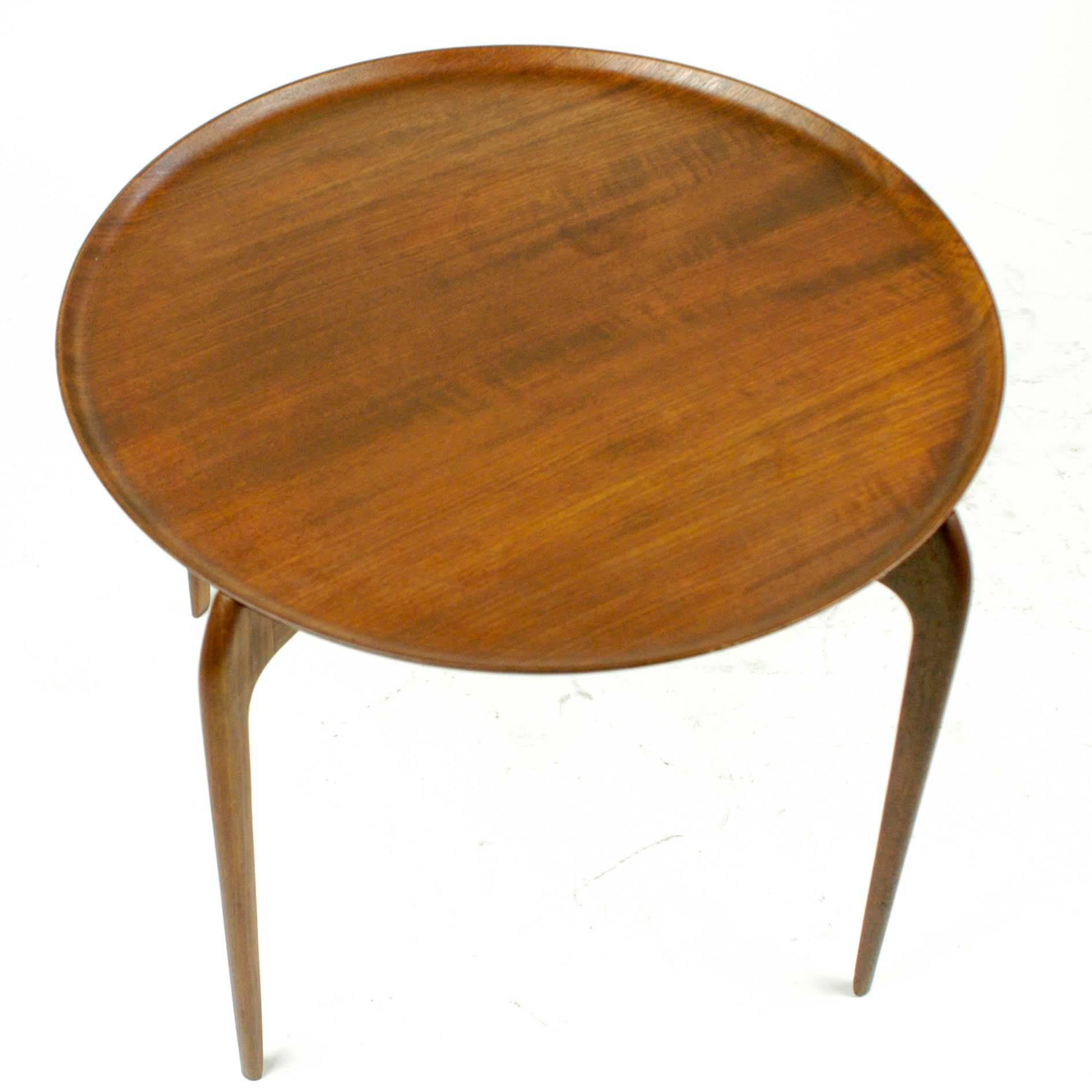 Charming Scandinavian sculpted teak side table with removable tray top.