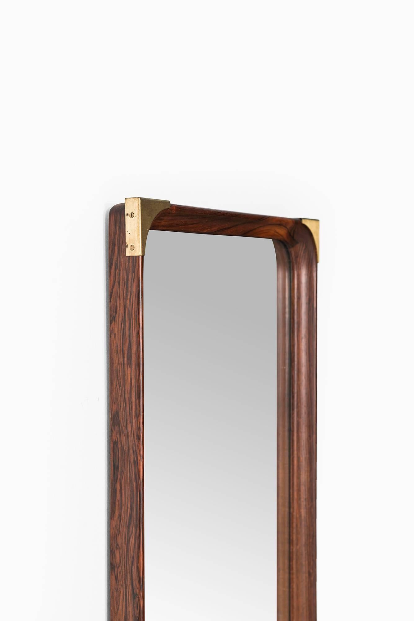 Swedish Rosewood Mirror with Brass Details Produced in Sweden