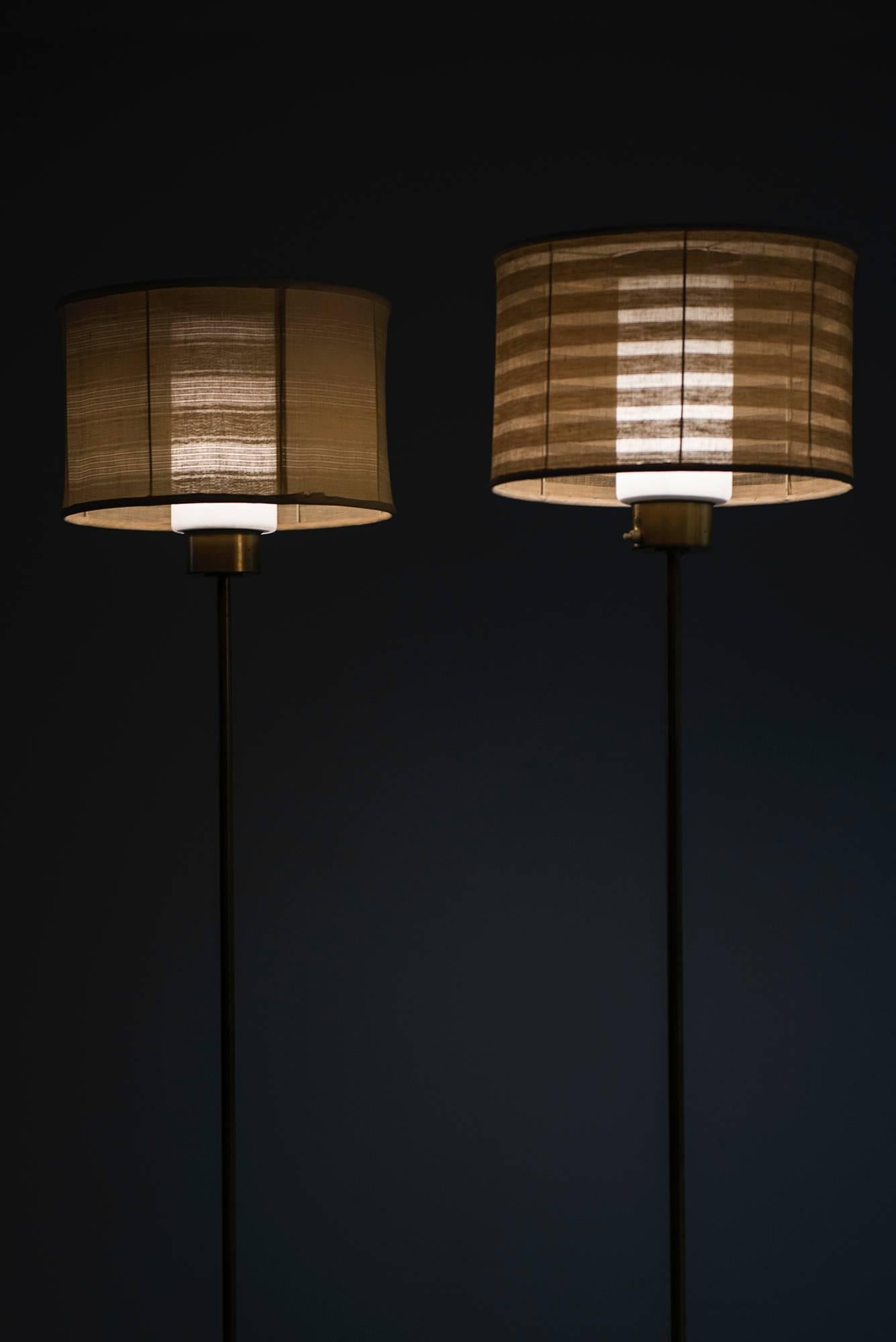 Mid-20th Century Hans-Agne Jakobsson Floor Lamps in Brass and Glass