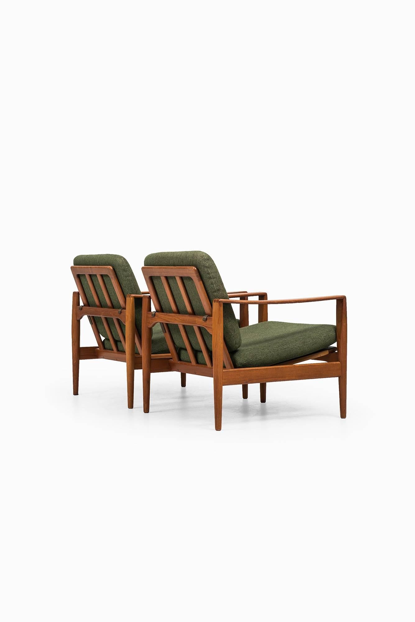 Rare pair of easy chairs designed by Illum Wikkelsø. Produced by Niels Eilersen in Denmark.